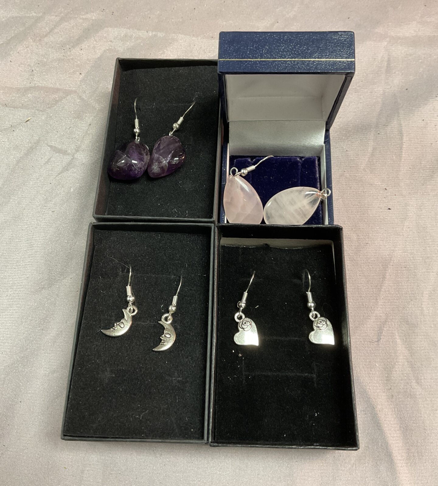 Four pairs silver earrings
