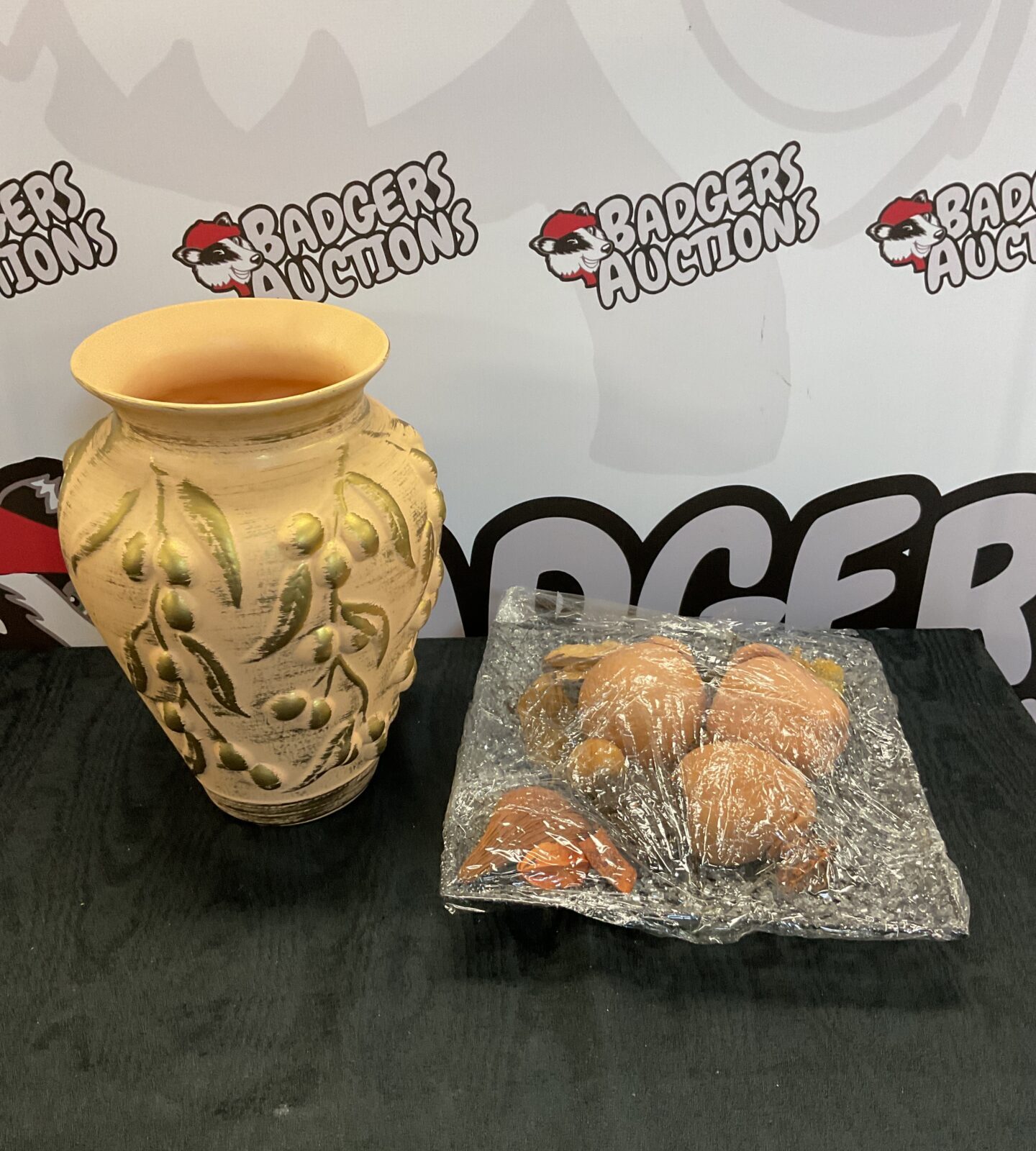 Pottery vase with gold details & metal dish of terracotta fruit