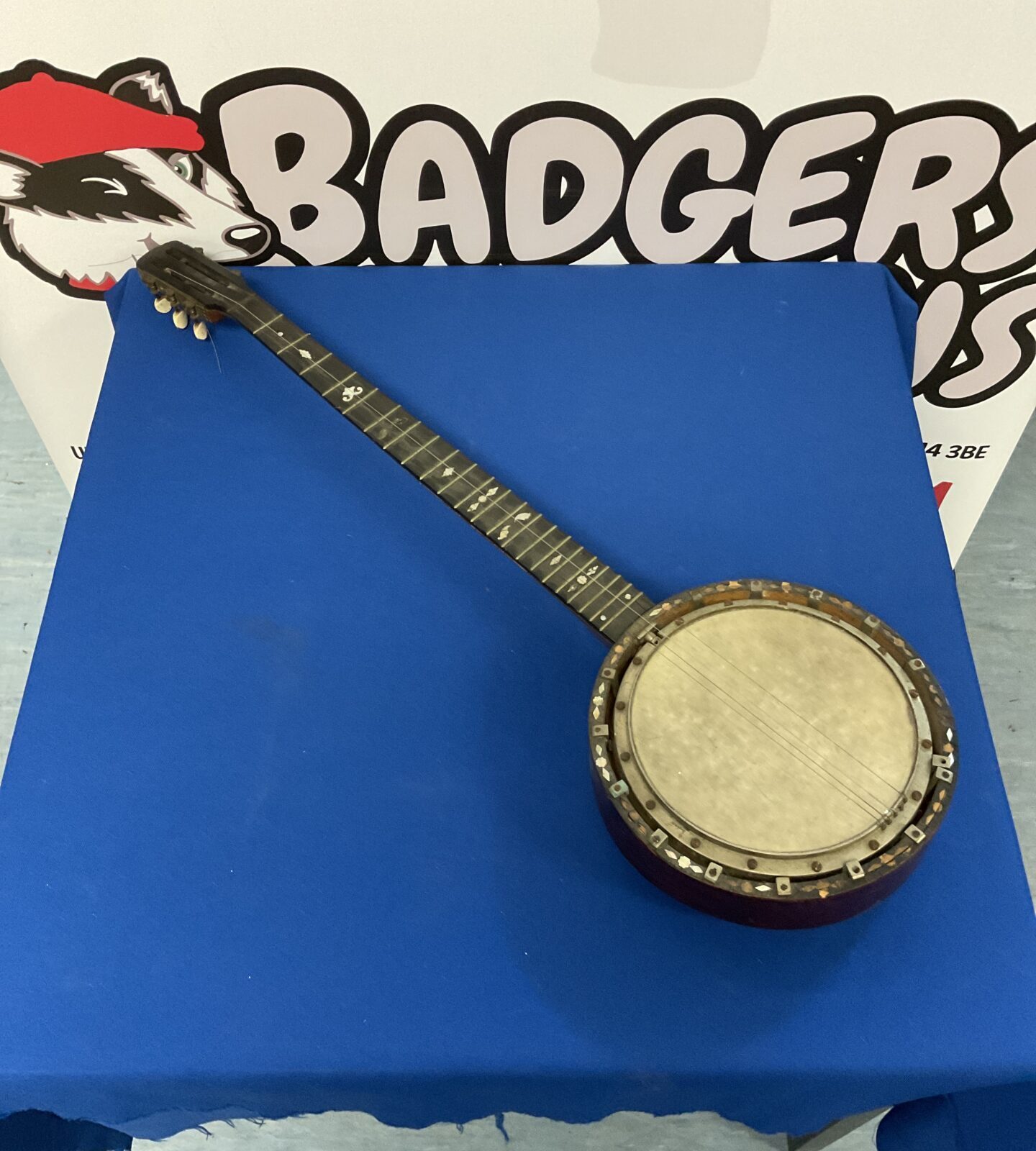 Antique six string banjo with mother of pearl inlay