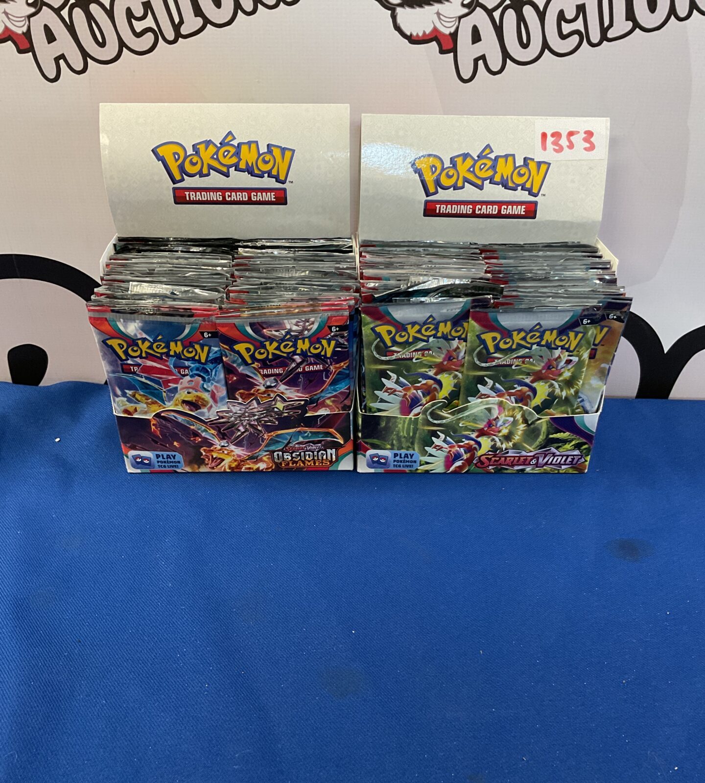 Two boxes of opened pokemon booster packs