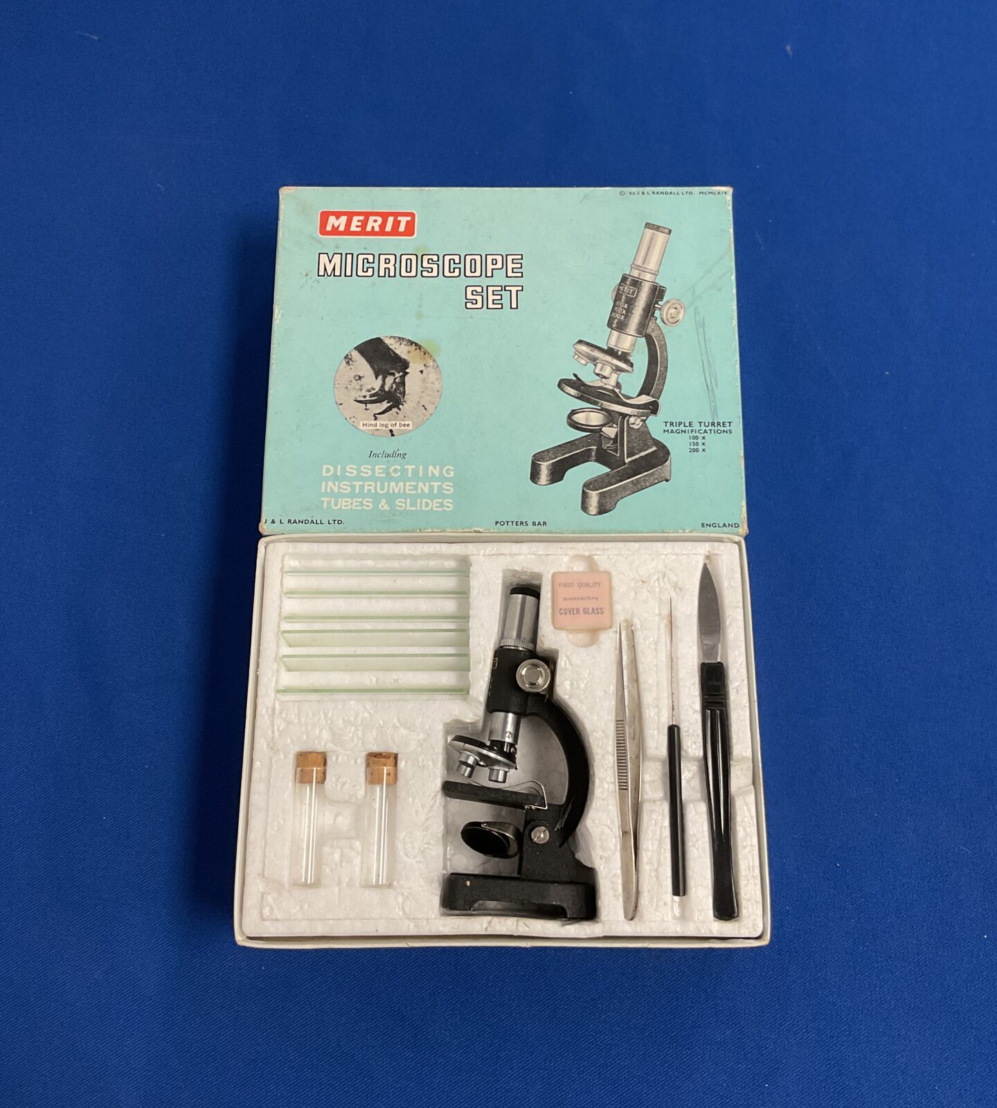 Vintage boxed Merit microscope set