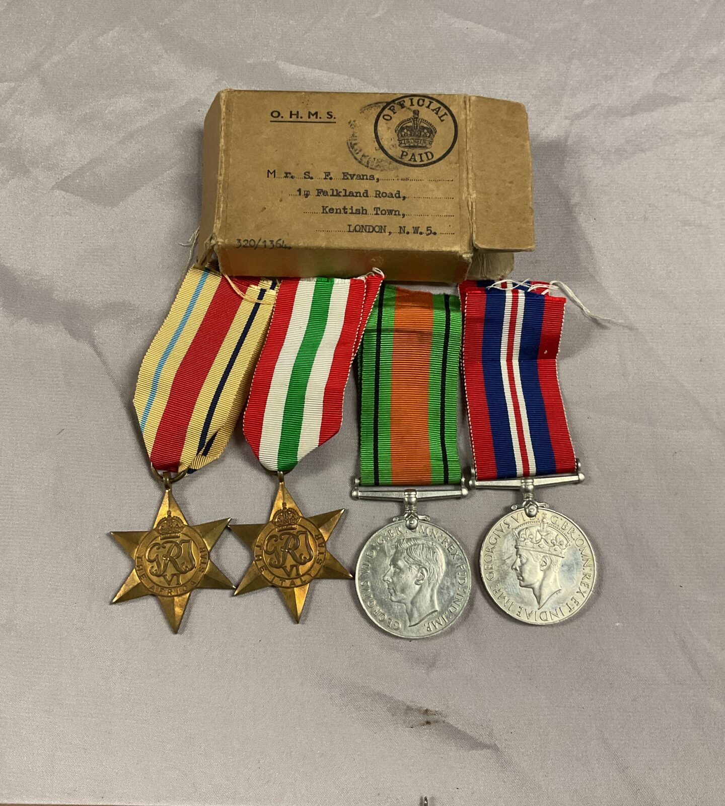 Boxed set of four ww2 medals  Africa Star Italy star defence and 1939/45 Medals