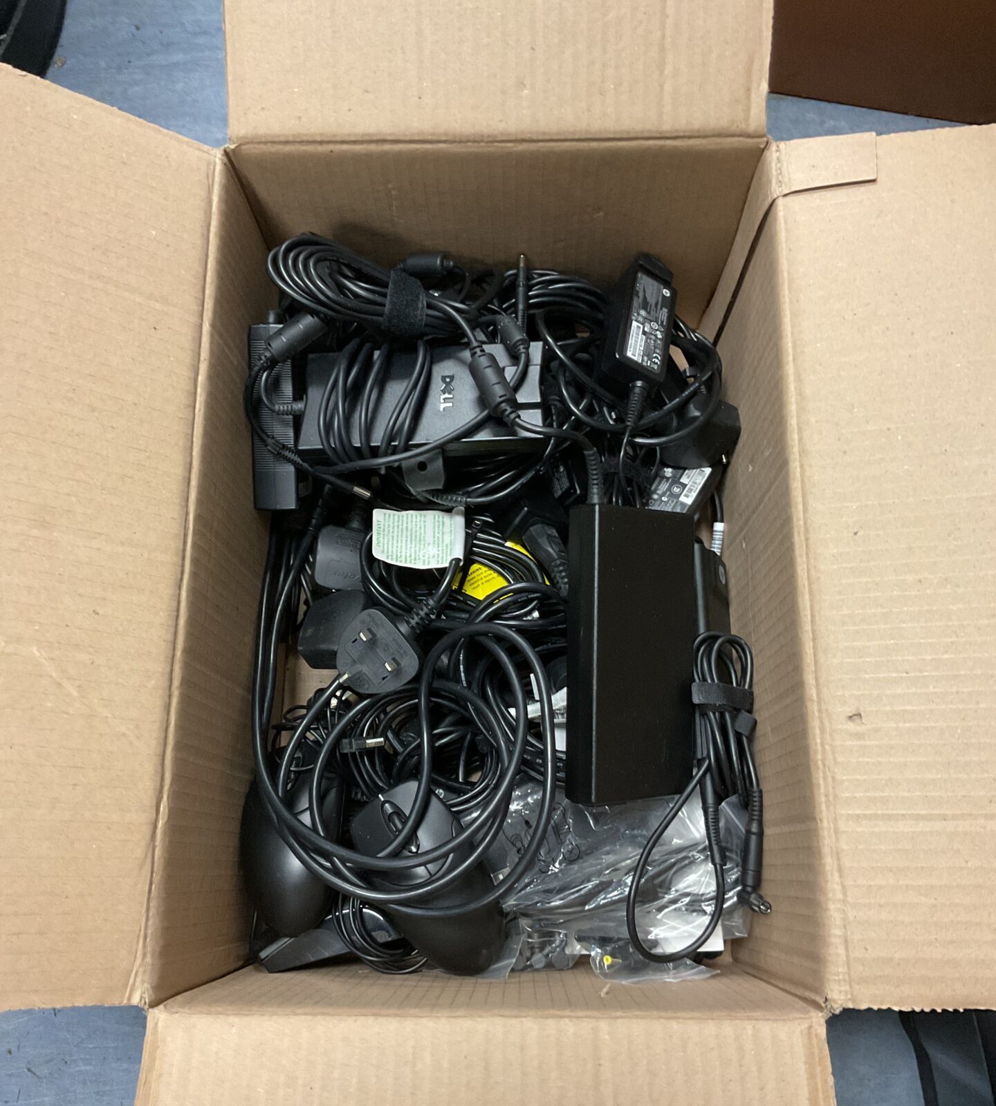 Box of computer laptop power supplies including dell & hp