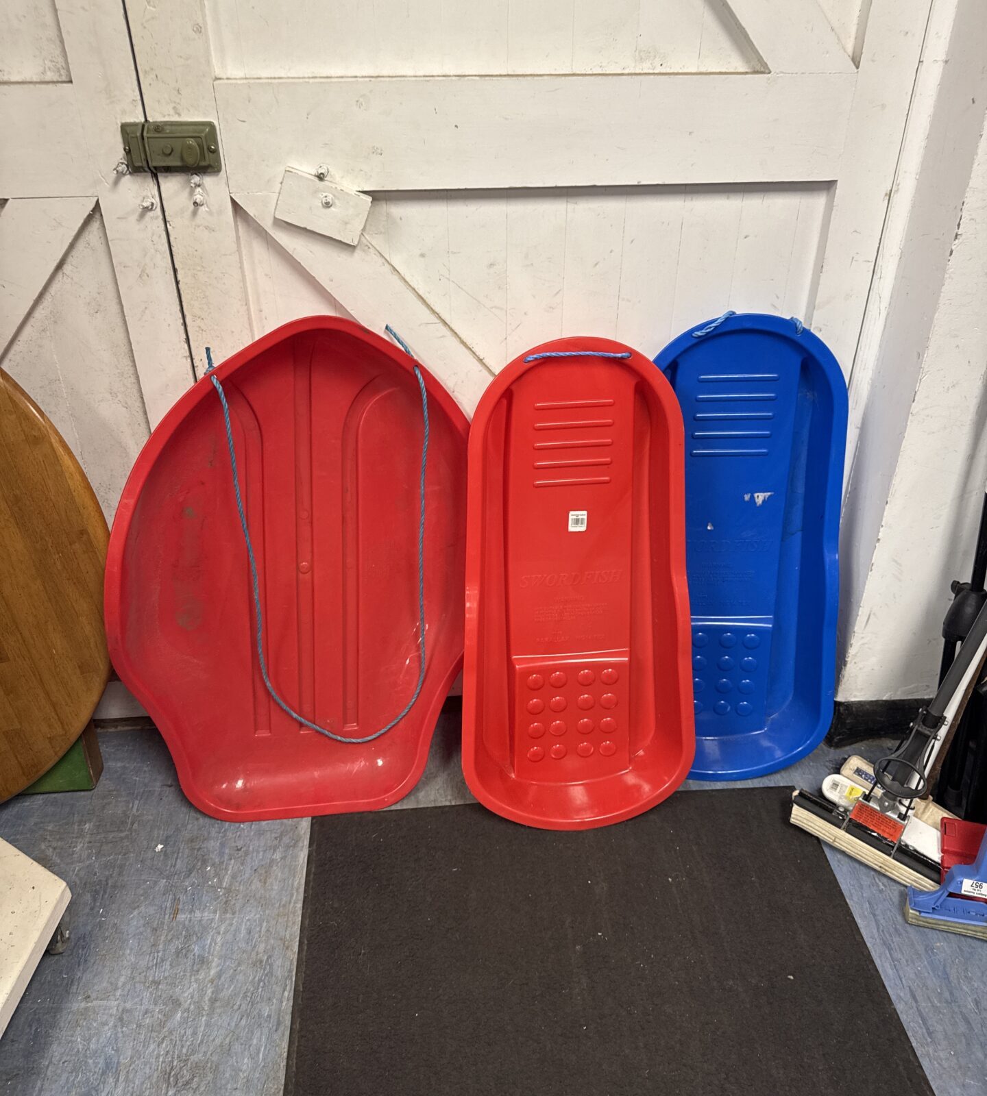 Three plastic snow sleds inc stingray & swordfish