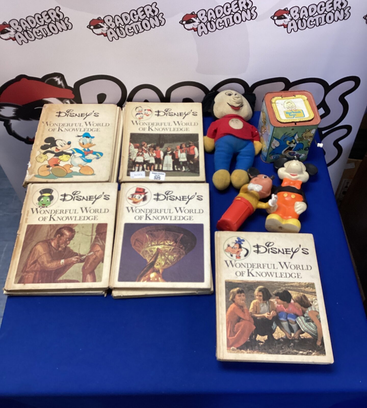 Selection of disneys wonderful world of knowledge book with four vintage disney toys inc three mickey mouse & tom & jerry jack in the box