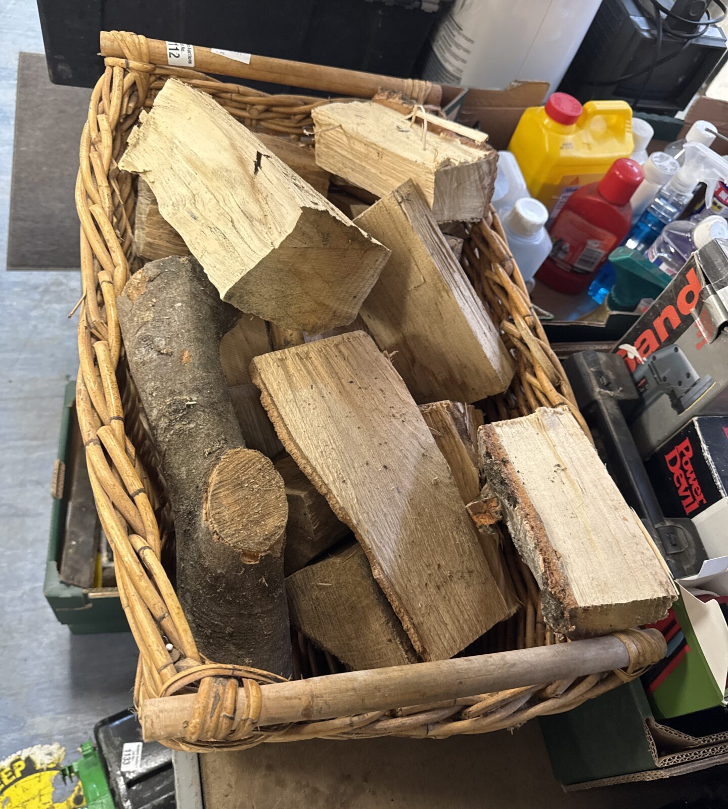 Wicker log basket with contents