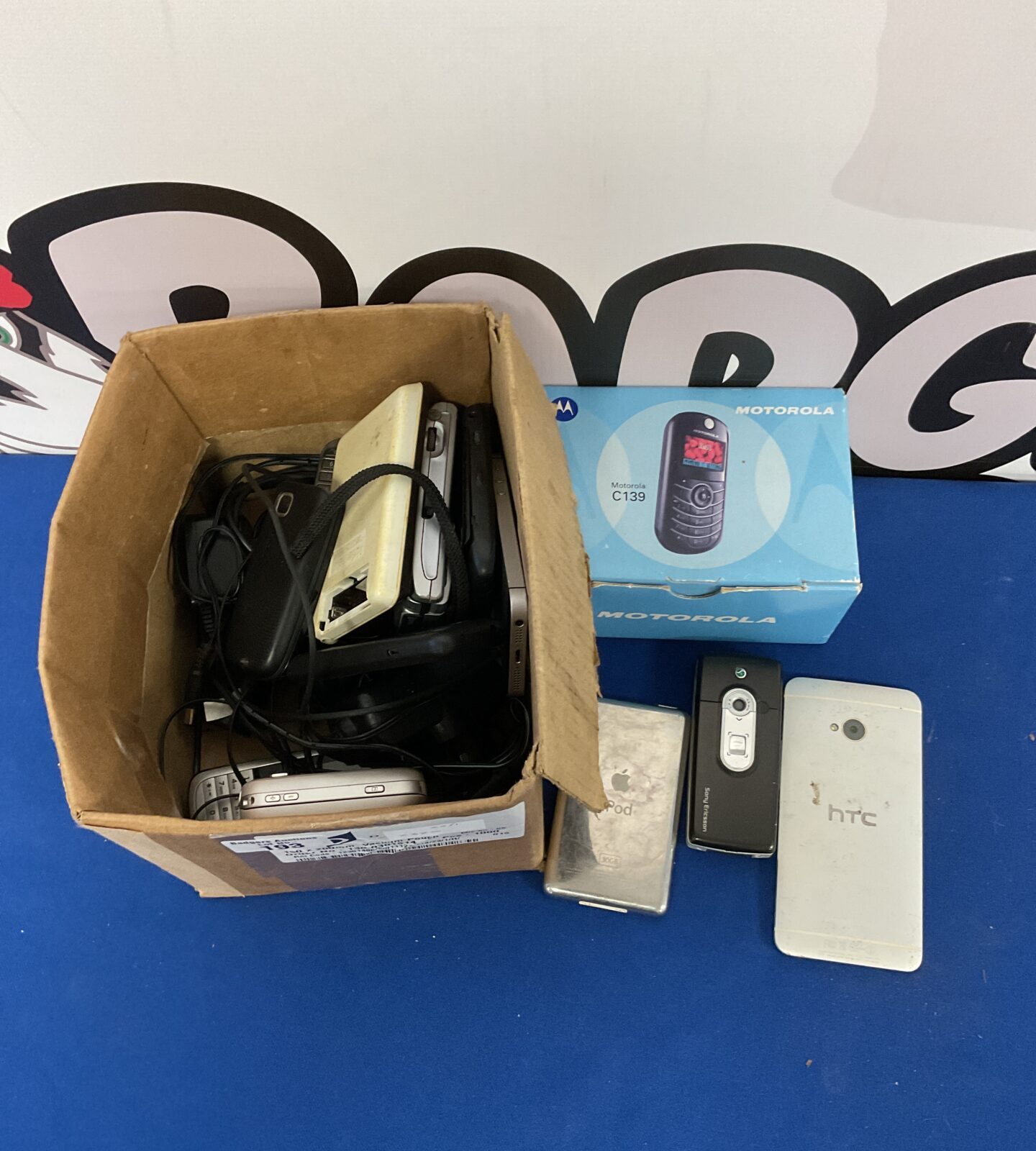 Box of retro mobile phones inc apple