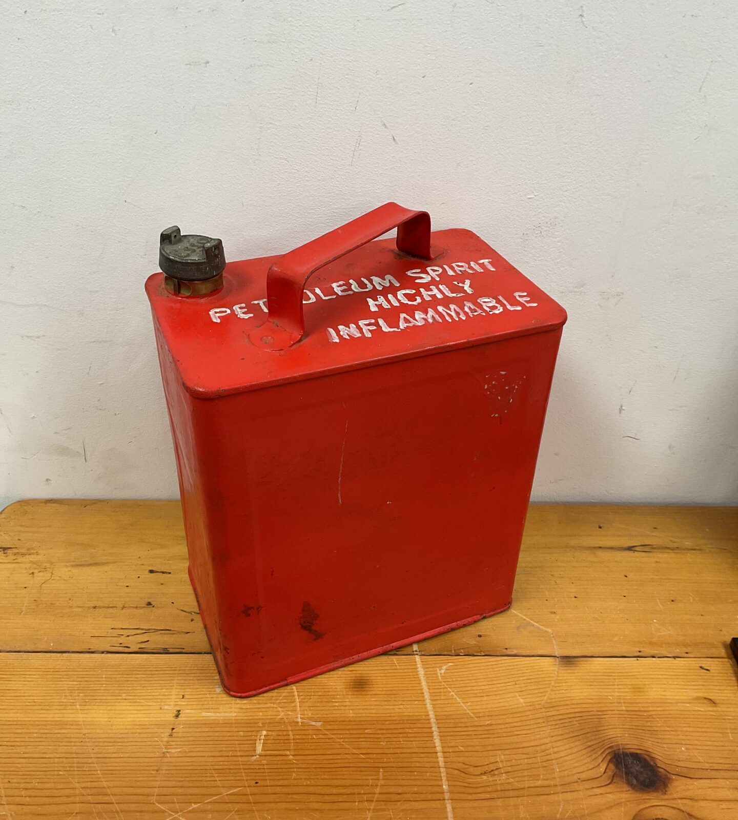 Vintage red fuel can with esso brass cap