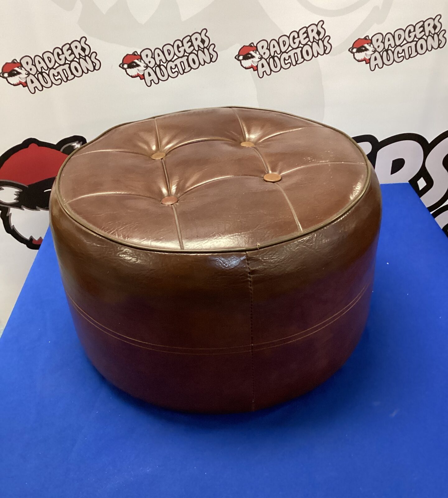 Brown leather pouffe