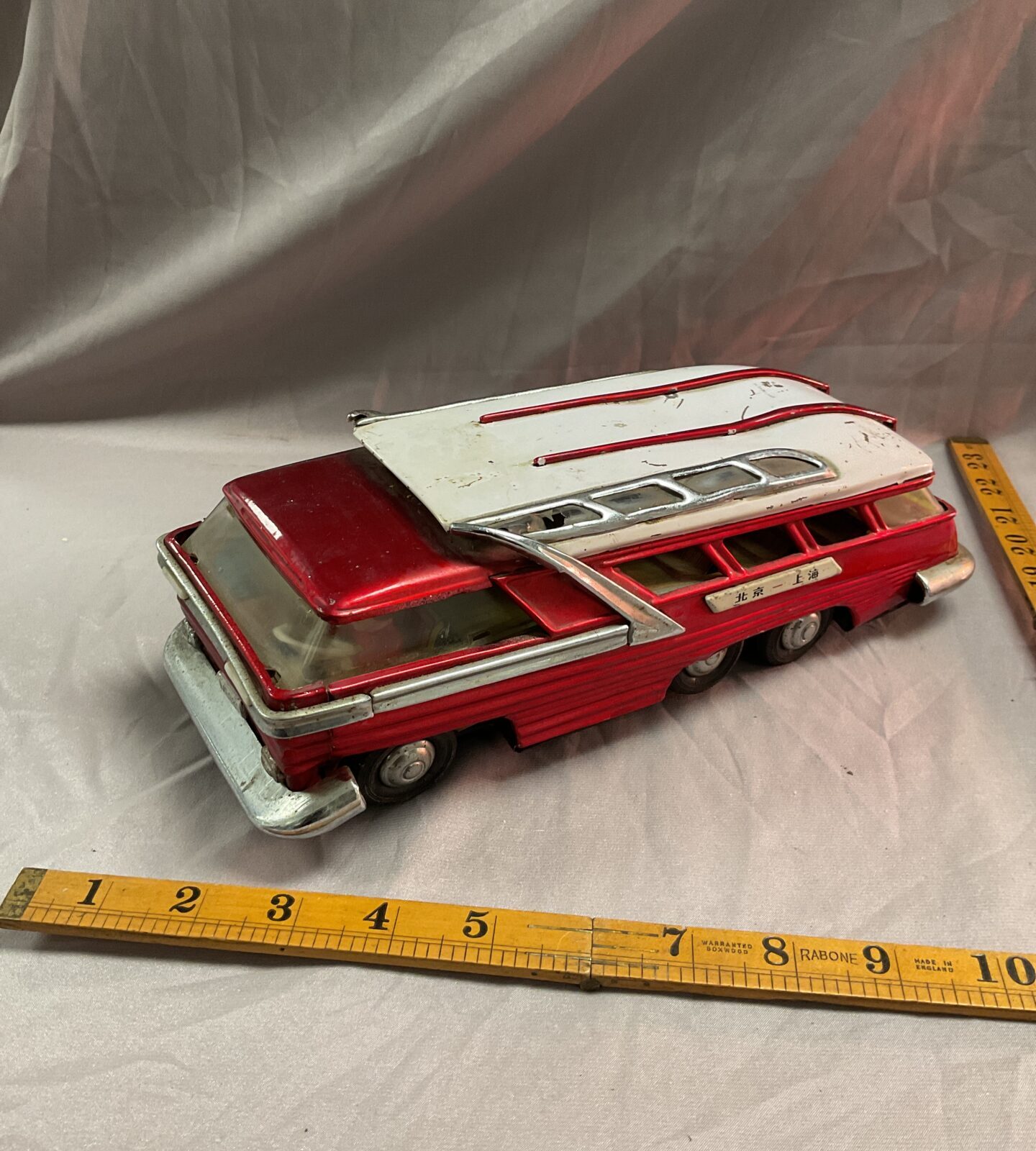 Vintage tin toy whirling battery electric car