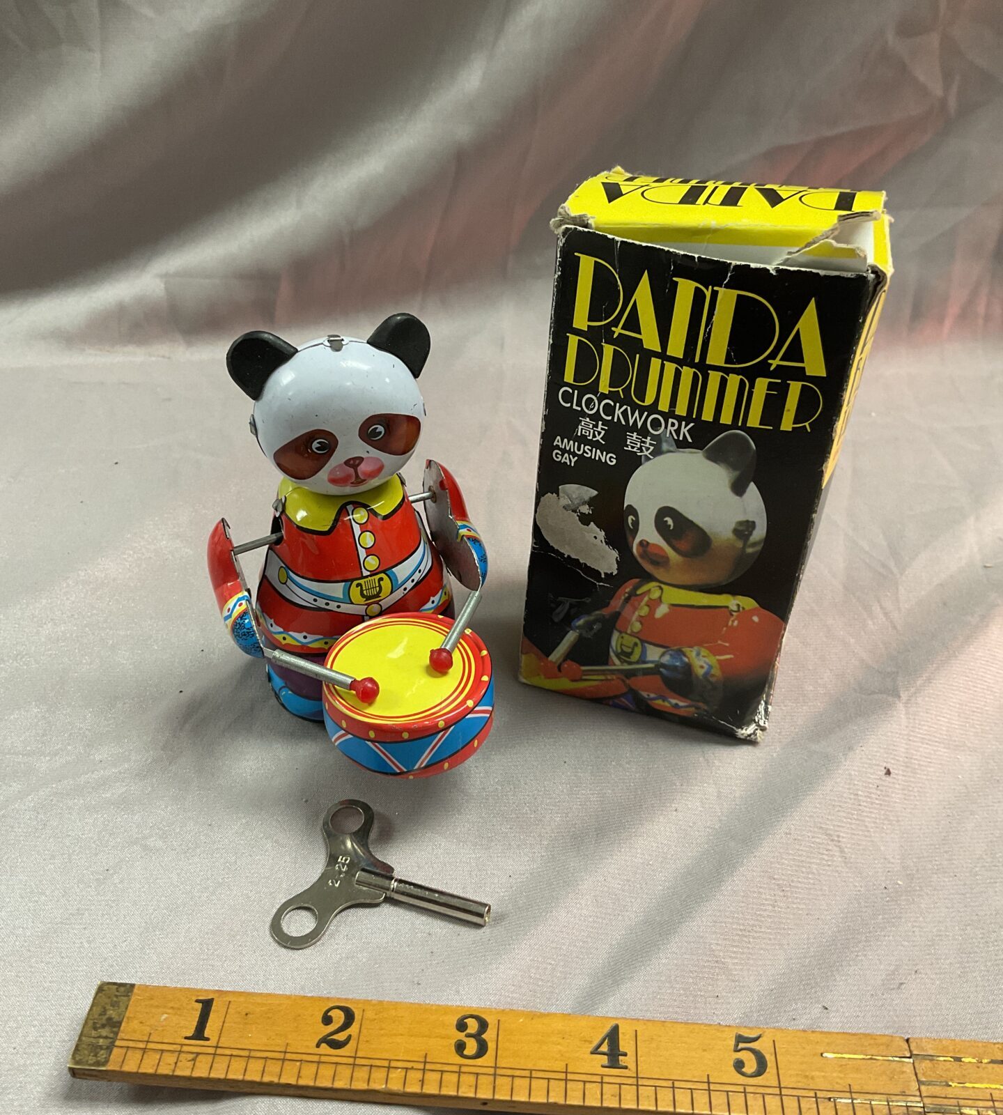 Tin Clockwork drumming panda