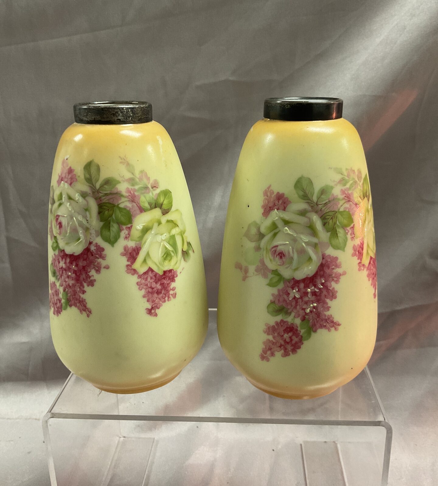 Pair of antique hand painted 5” vases with hallmarked silver rims