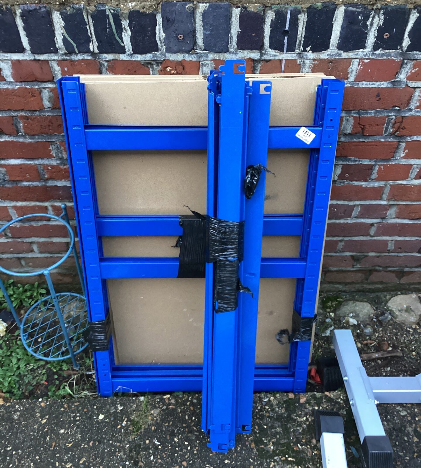 Blue metal racking with MDF sheets