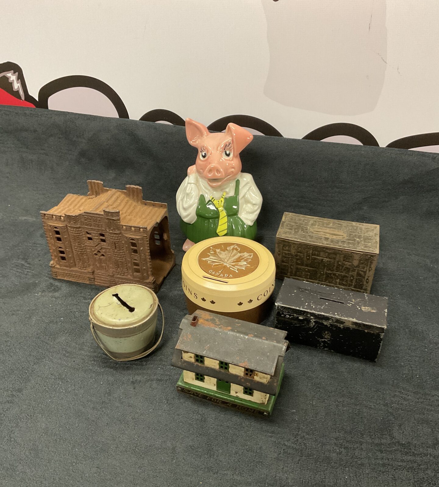 Collection of vintage moneyboxes including natwest pig