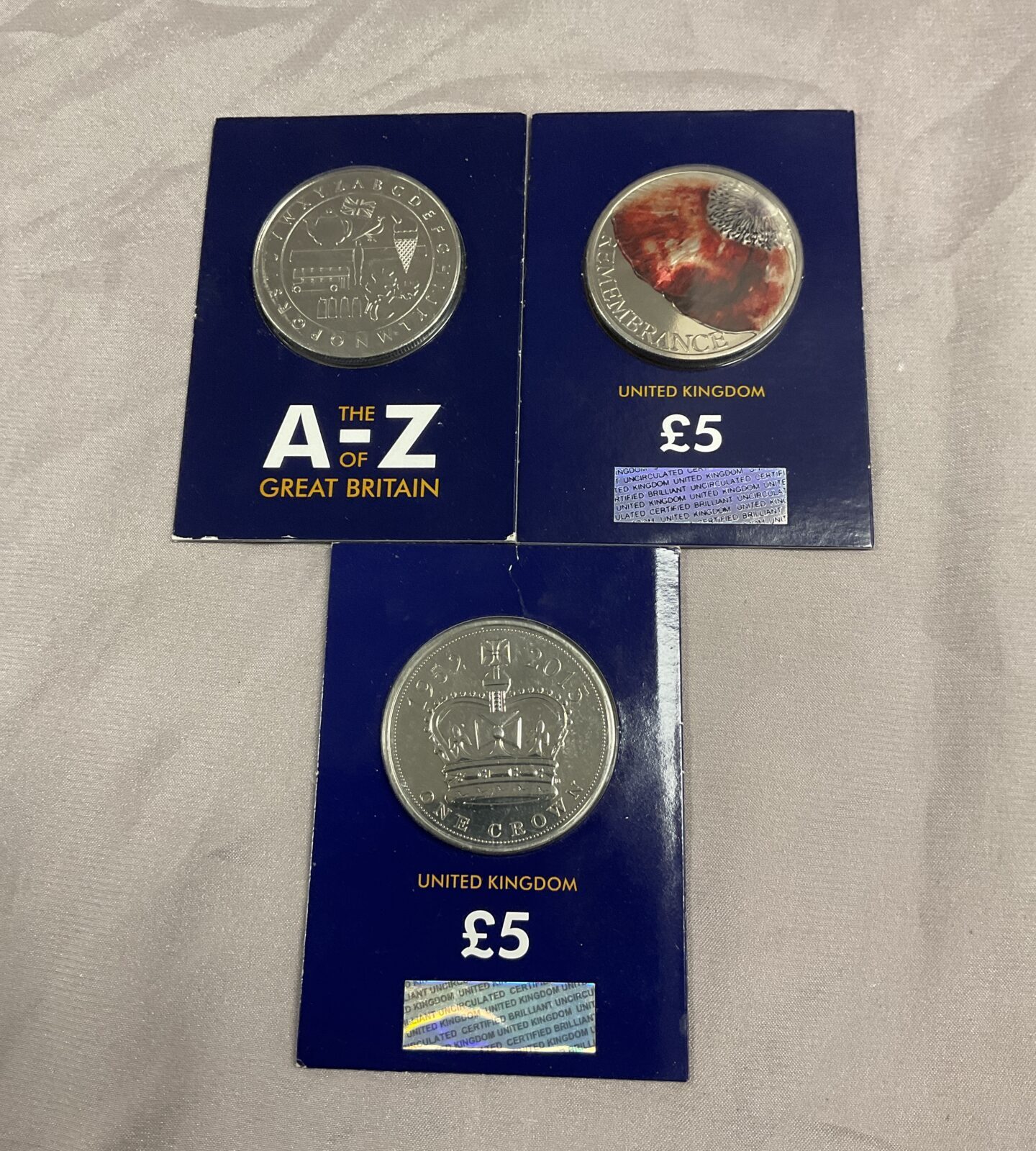 Three Change checker coins A-Z and two £5 Coins - Image 2