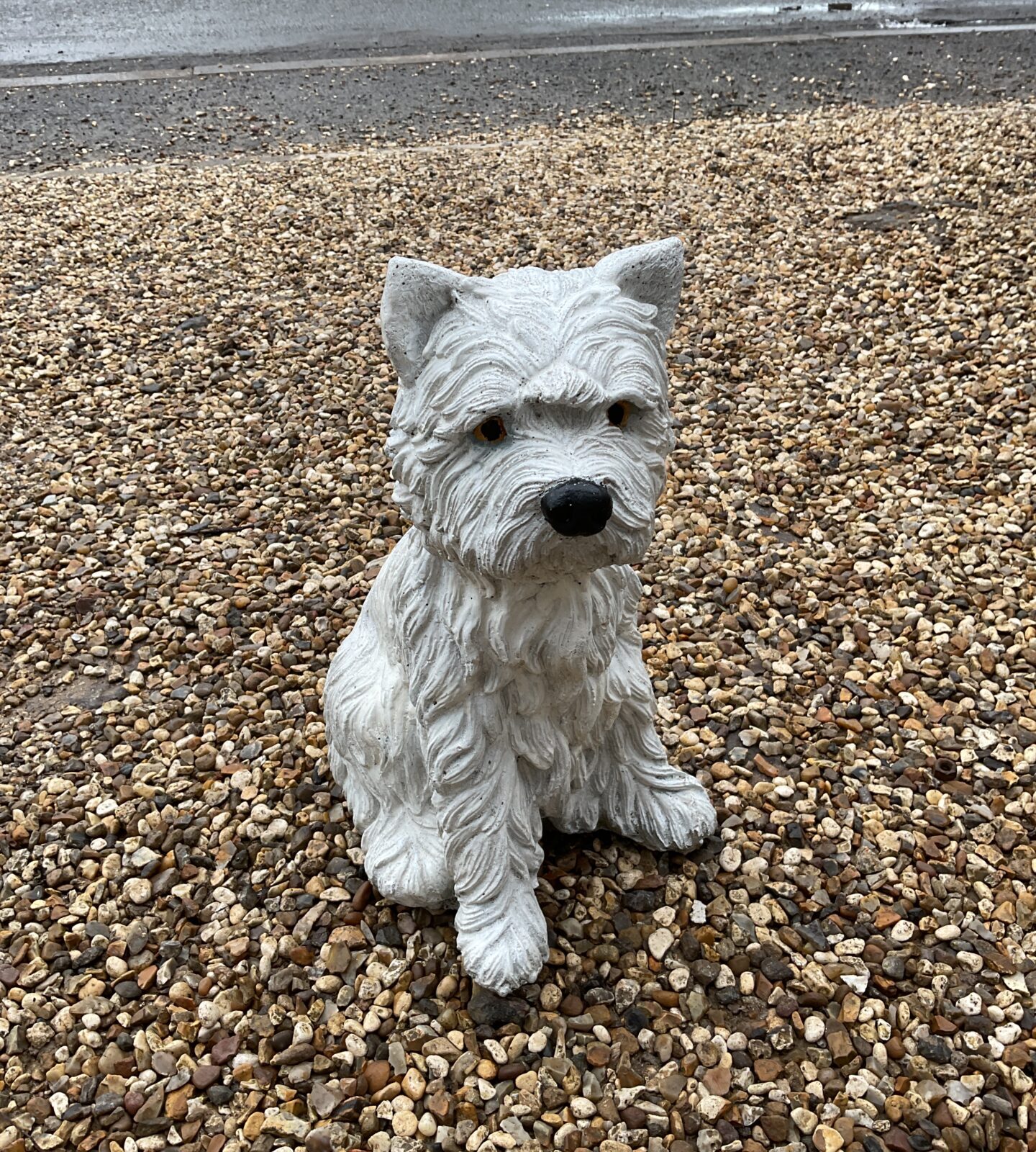 Reconstituted stone westie dog