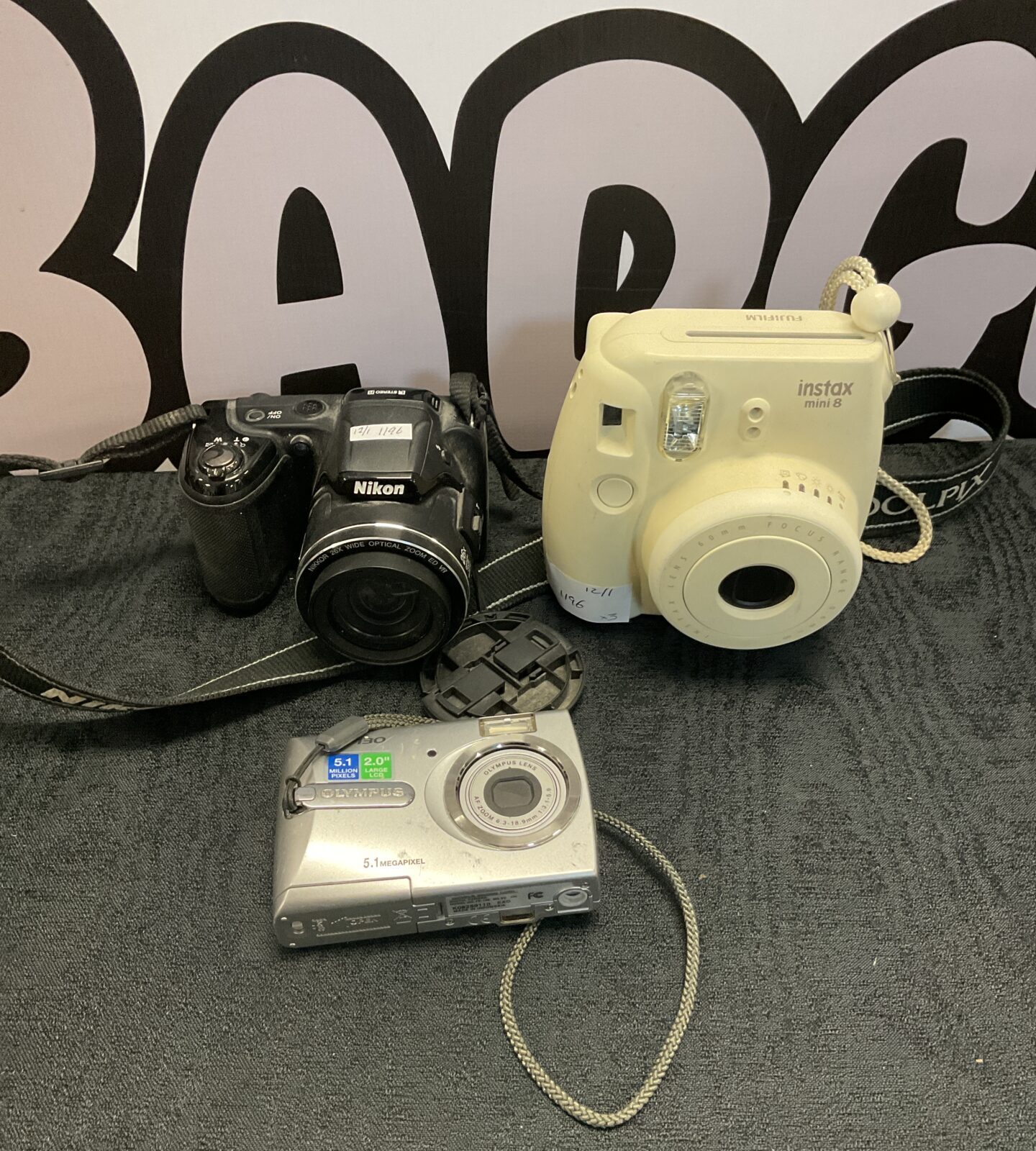 Three cameras including nikon l810 & olympus fe-130