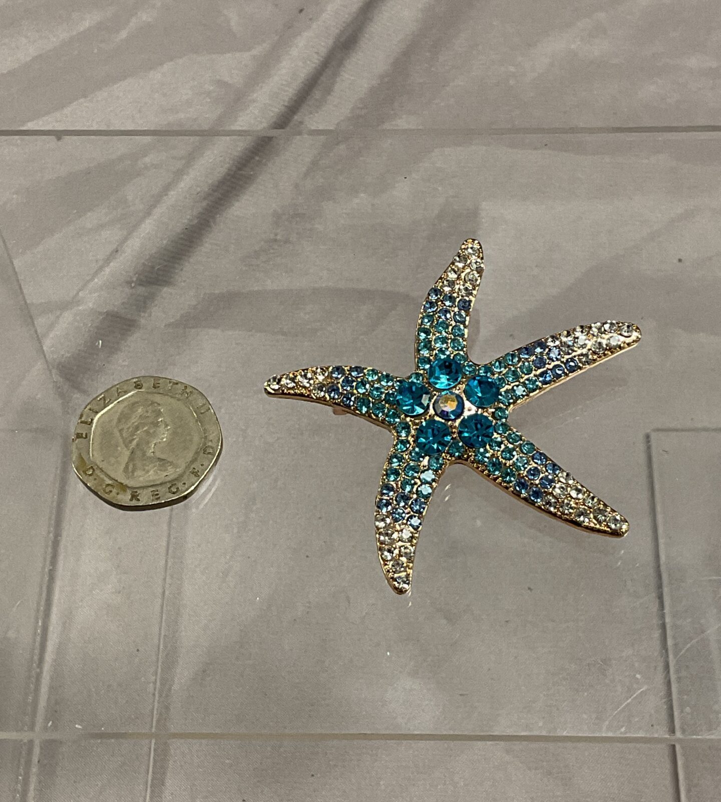 Blue and white stone starfish brooch