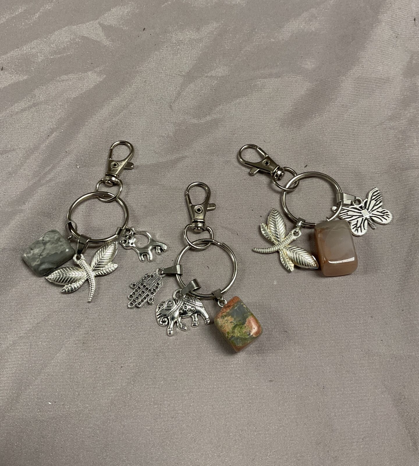 three charm and stone Keyrings