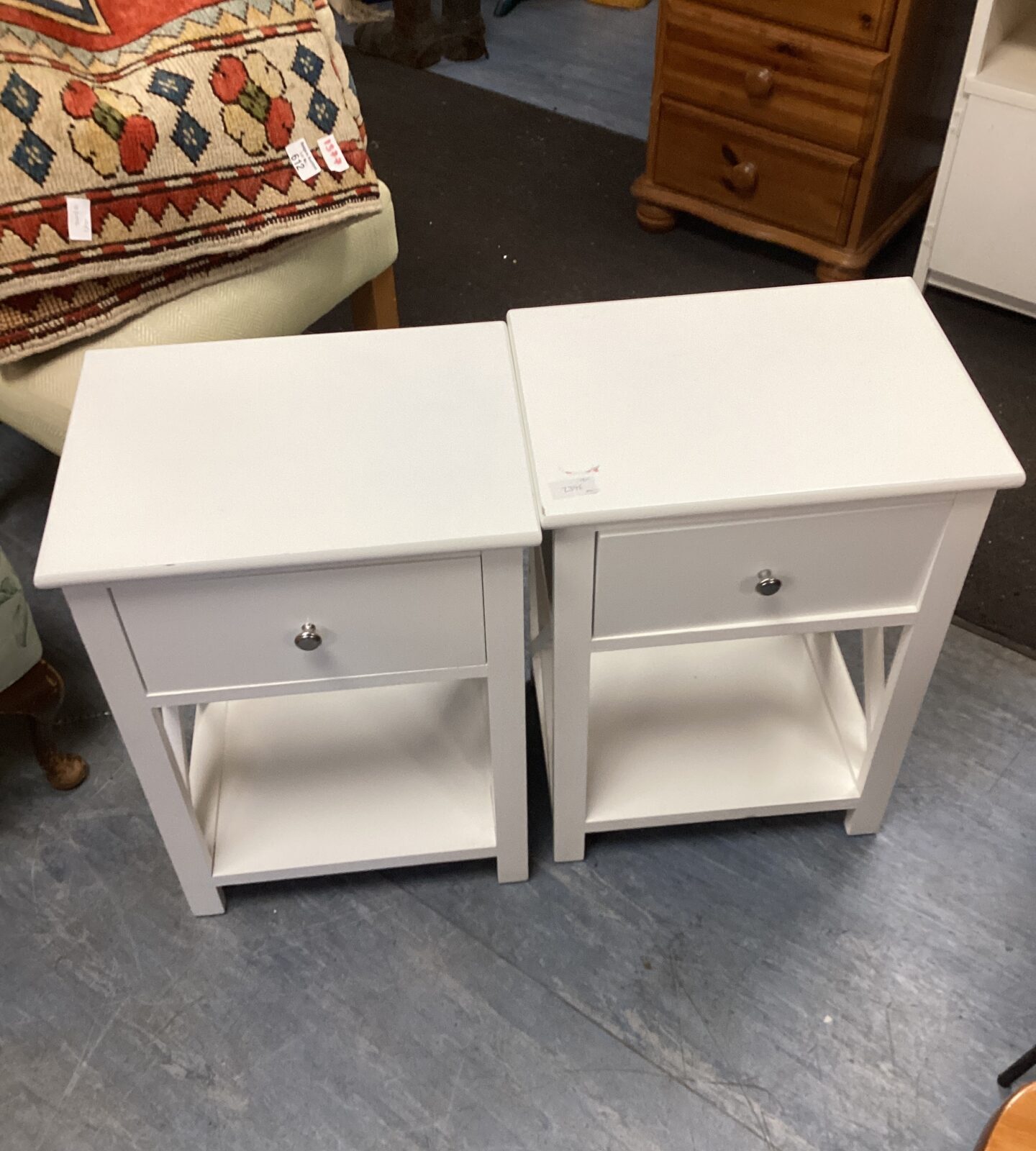 Two white bedside cabinets