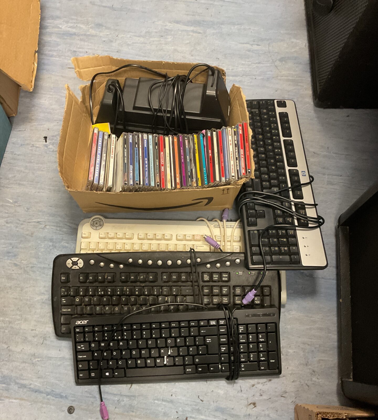 Box of computer keyboards, speakers & software