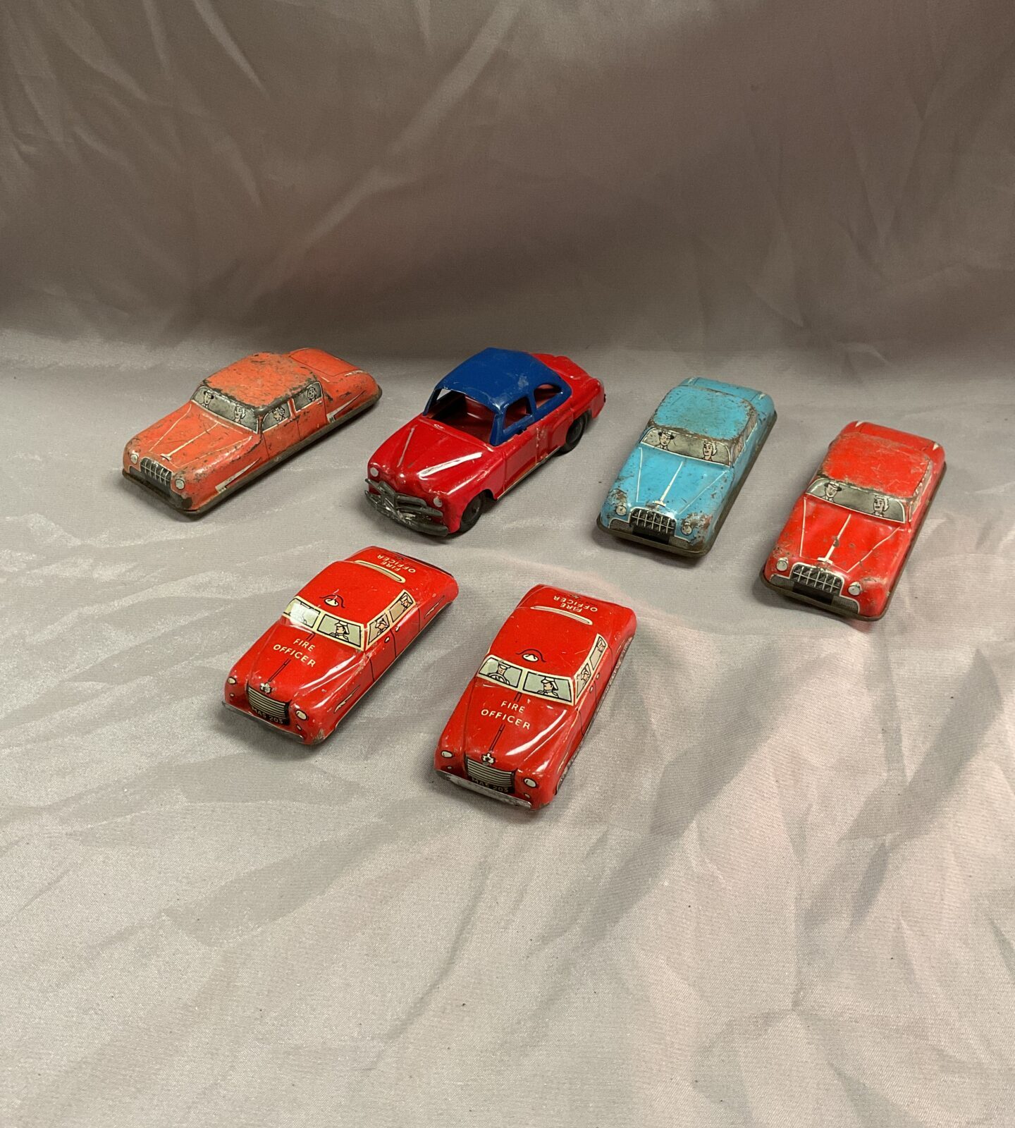 Six vintage tin plate cars