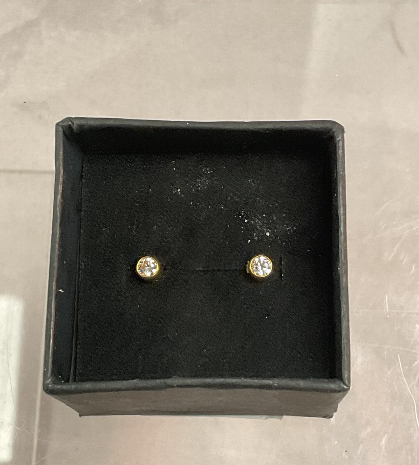 Pair of 9ct gold stud earrings with white stones