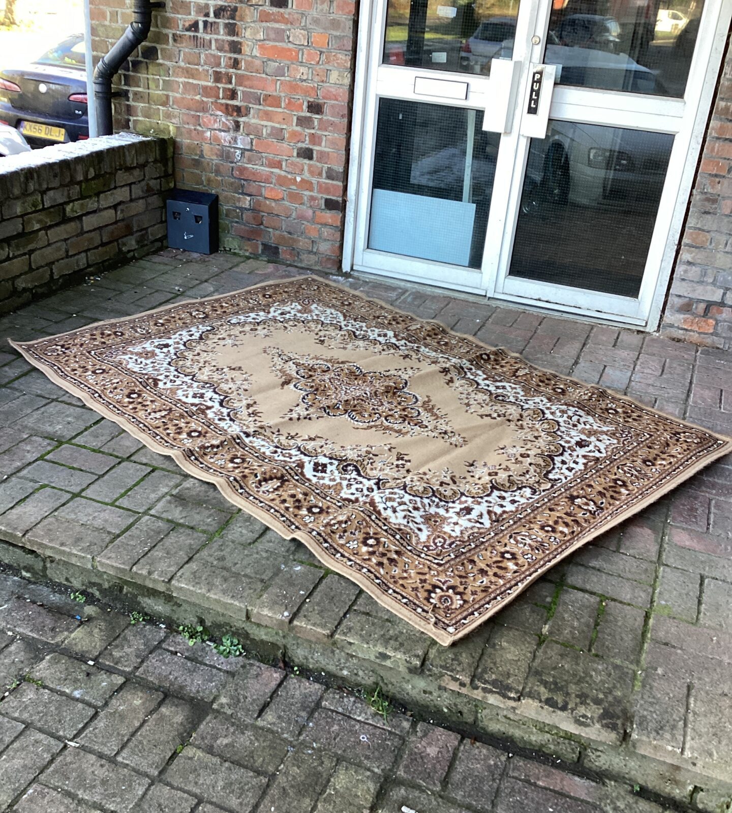 Brown & cream coloured rug approximately 7ft x 5ft