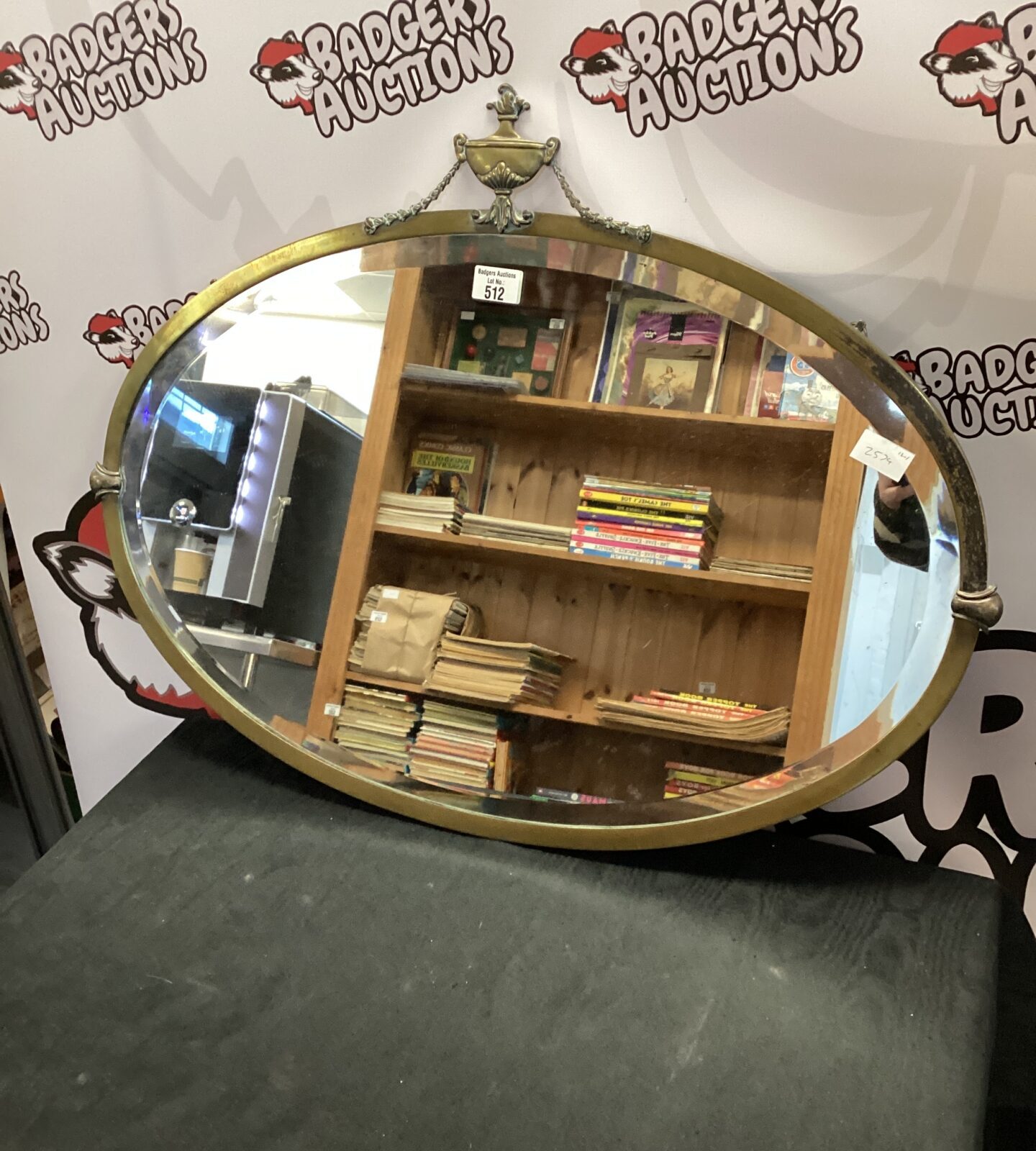 Victorian bevel edged brass surround oval mirror