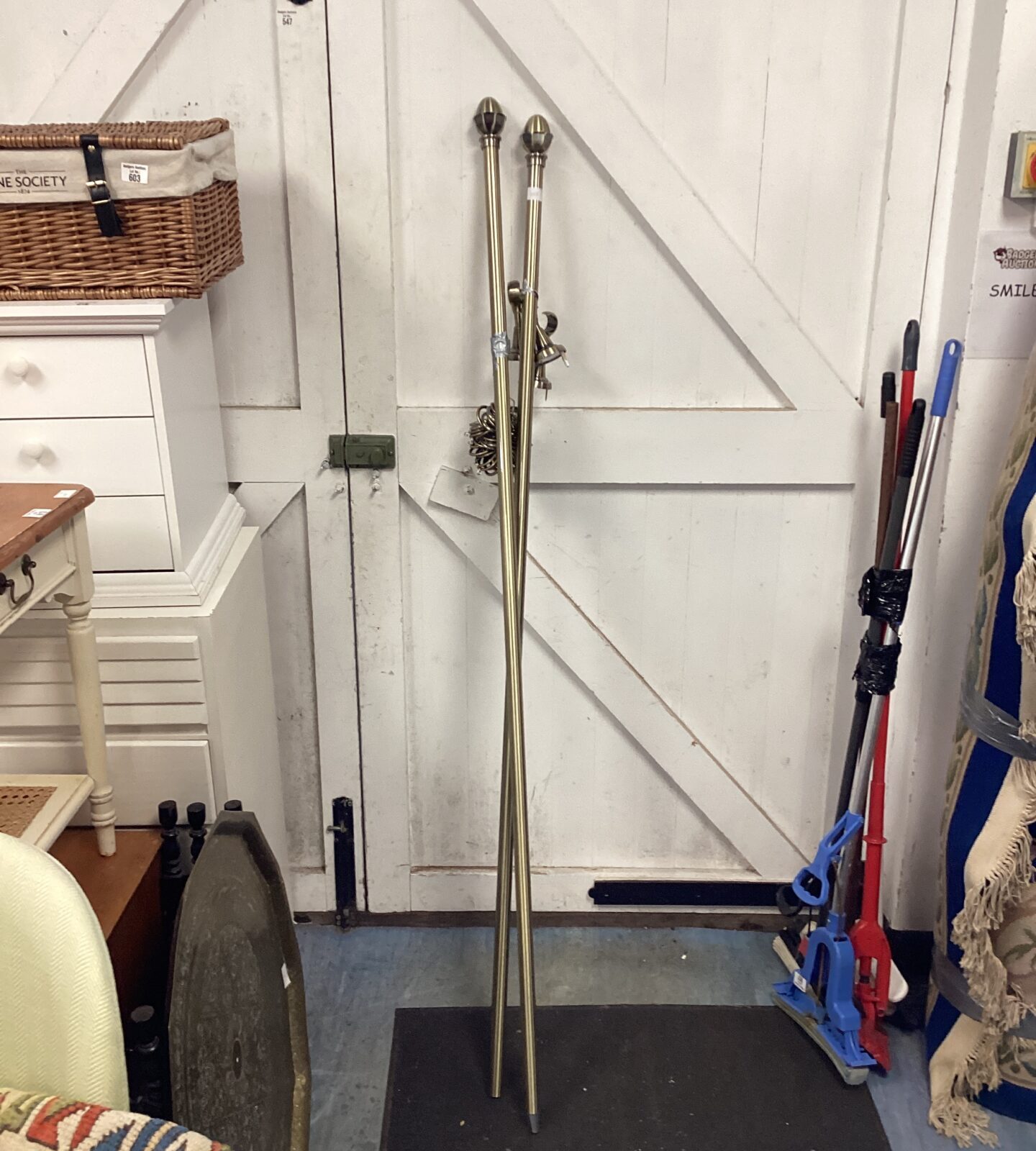 Brass curtain railings with curtain hooks