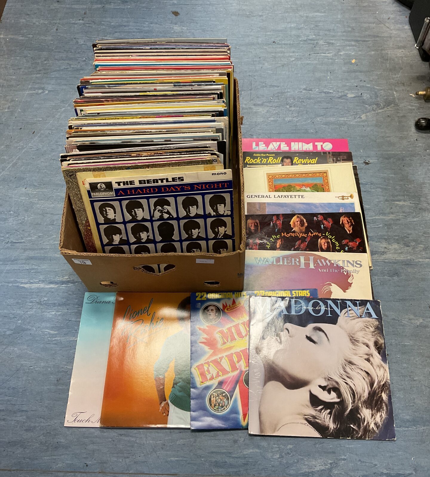 Large box of 12” vinyl records including the beatles & madonna