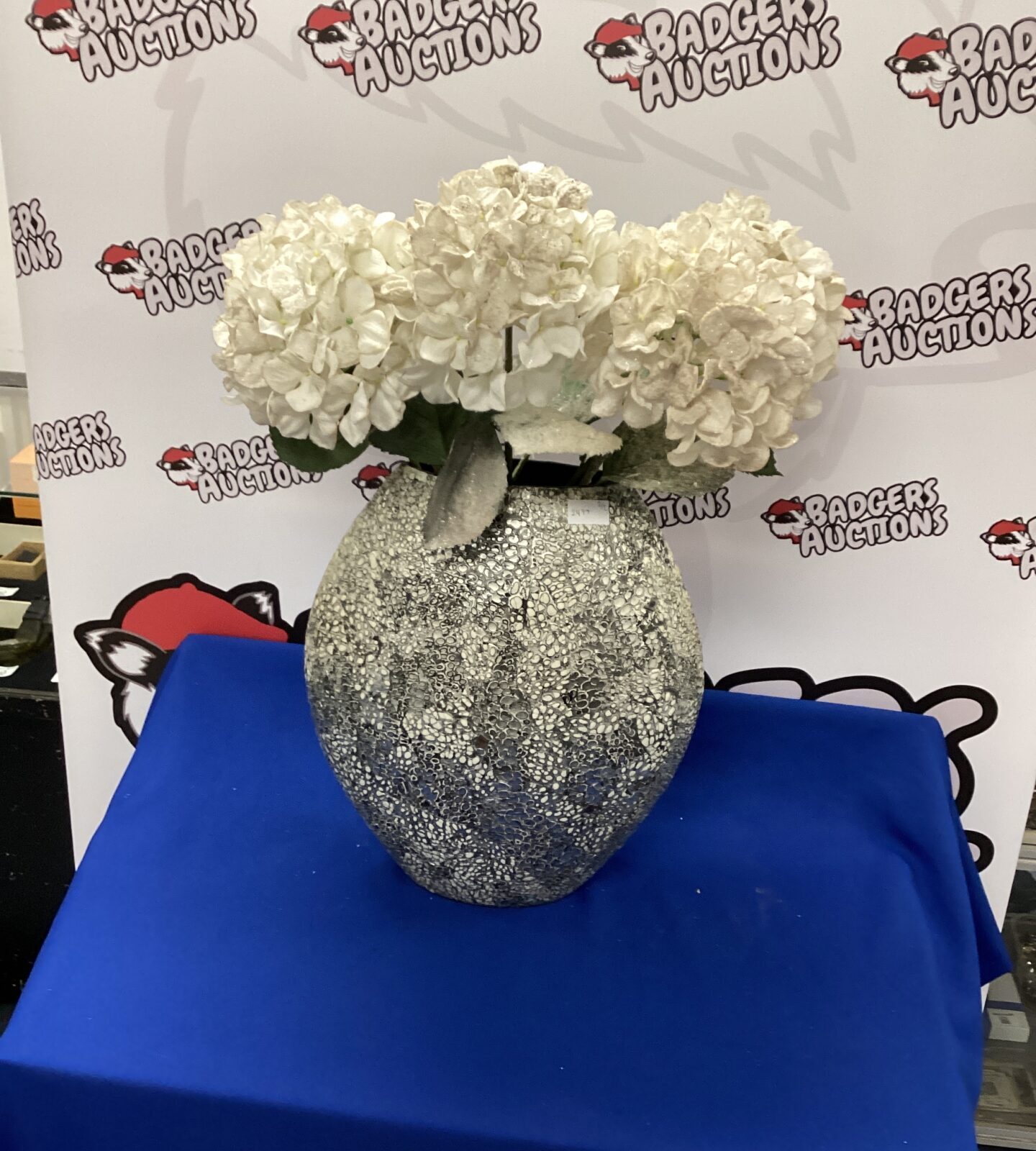 Large modern vase with artificial flowers