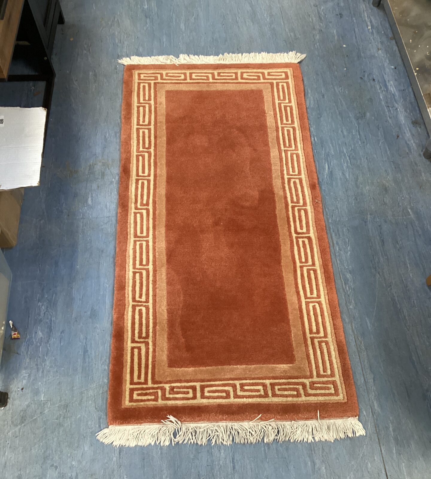 Orange aztec pattern rug approximately 4ft x 2ft