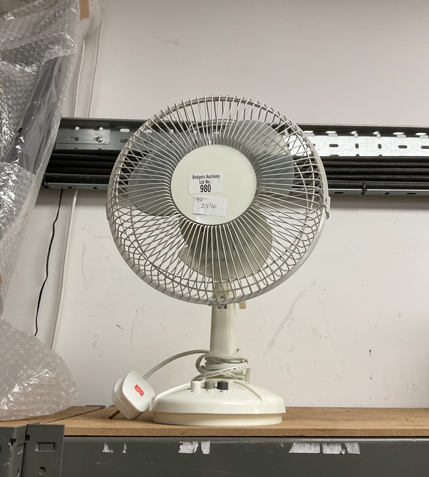 Small white desk fan working