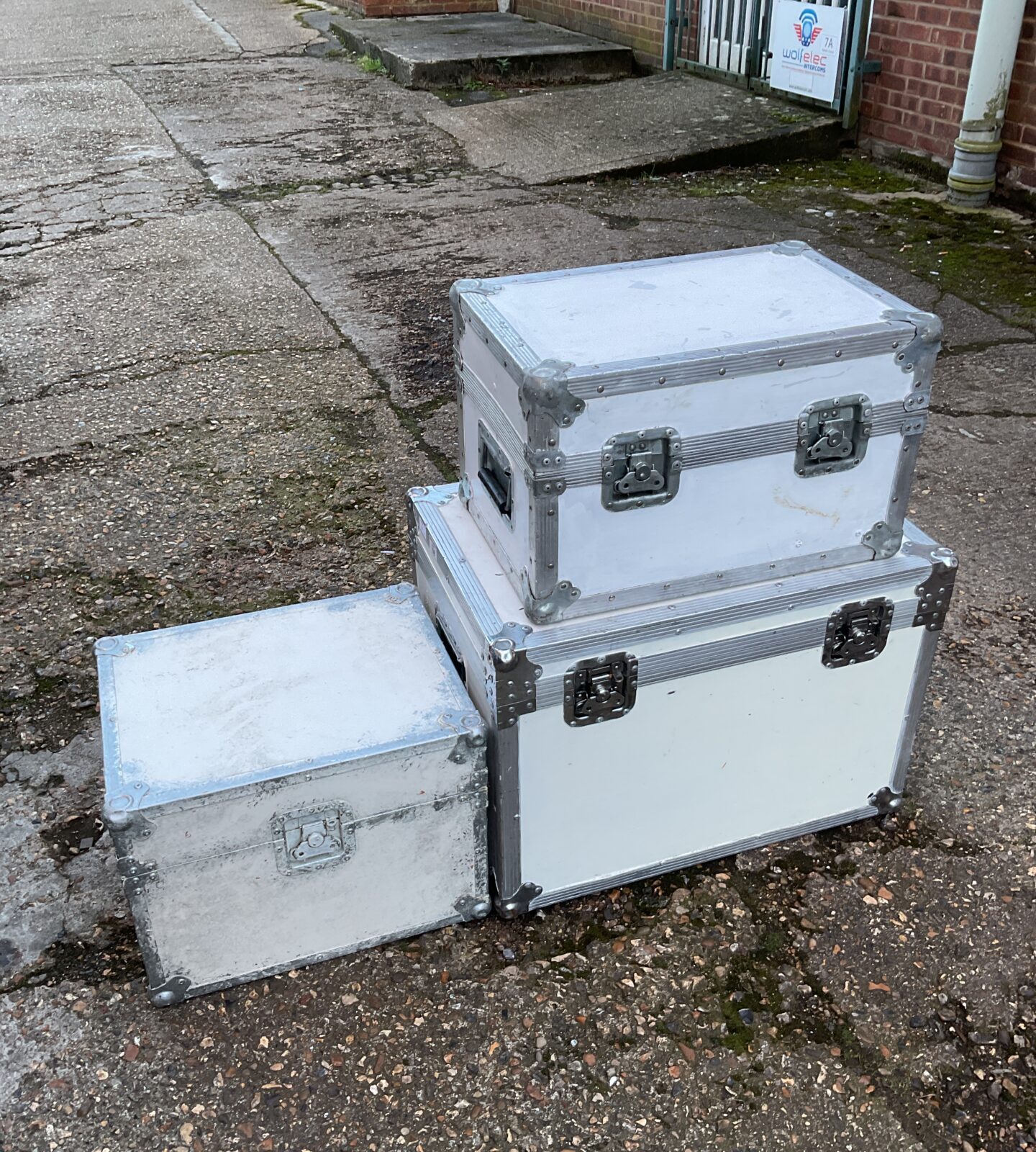 Three white painted aluminium transit boxes