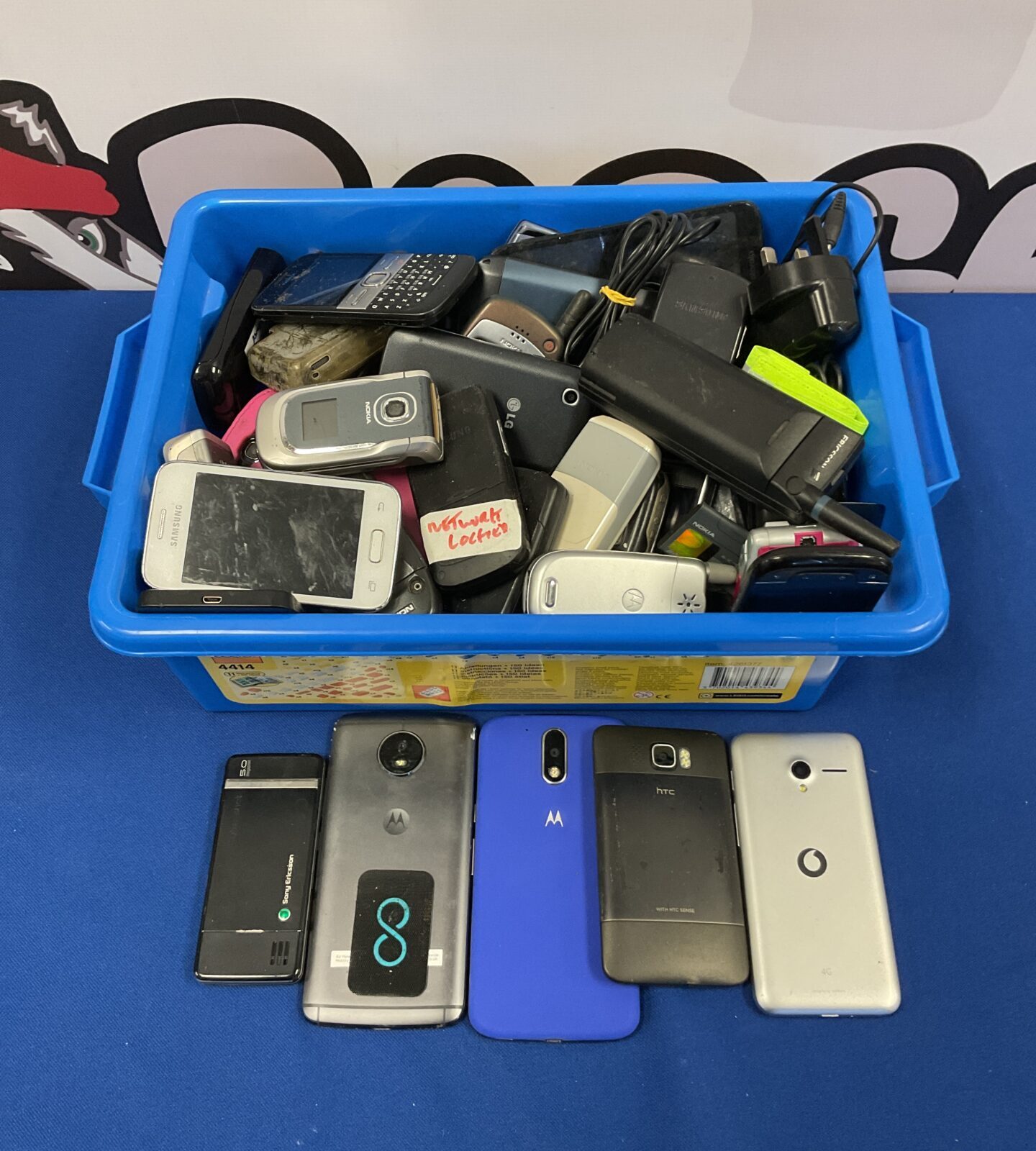 Tray of mobile phones & chargers