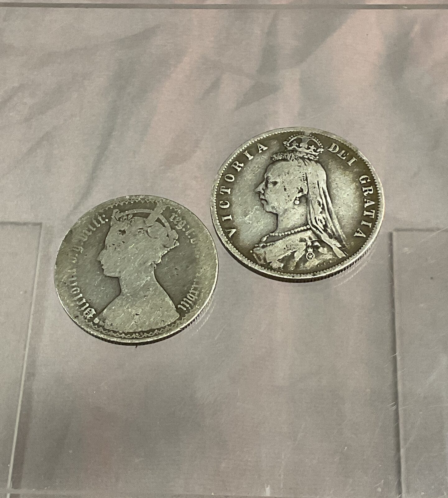 Two Victorian silver coins early florin and 1888 half crown