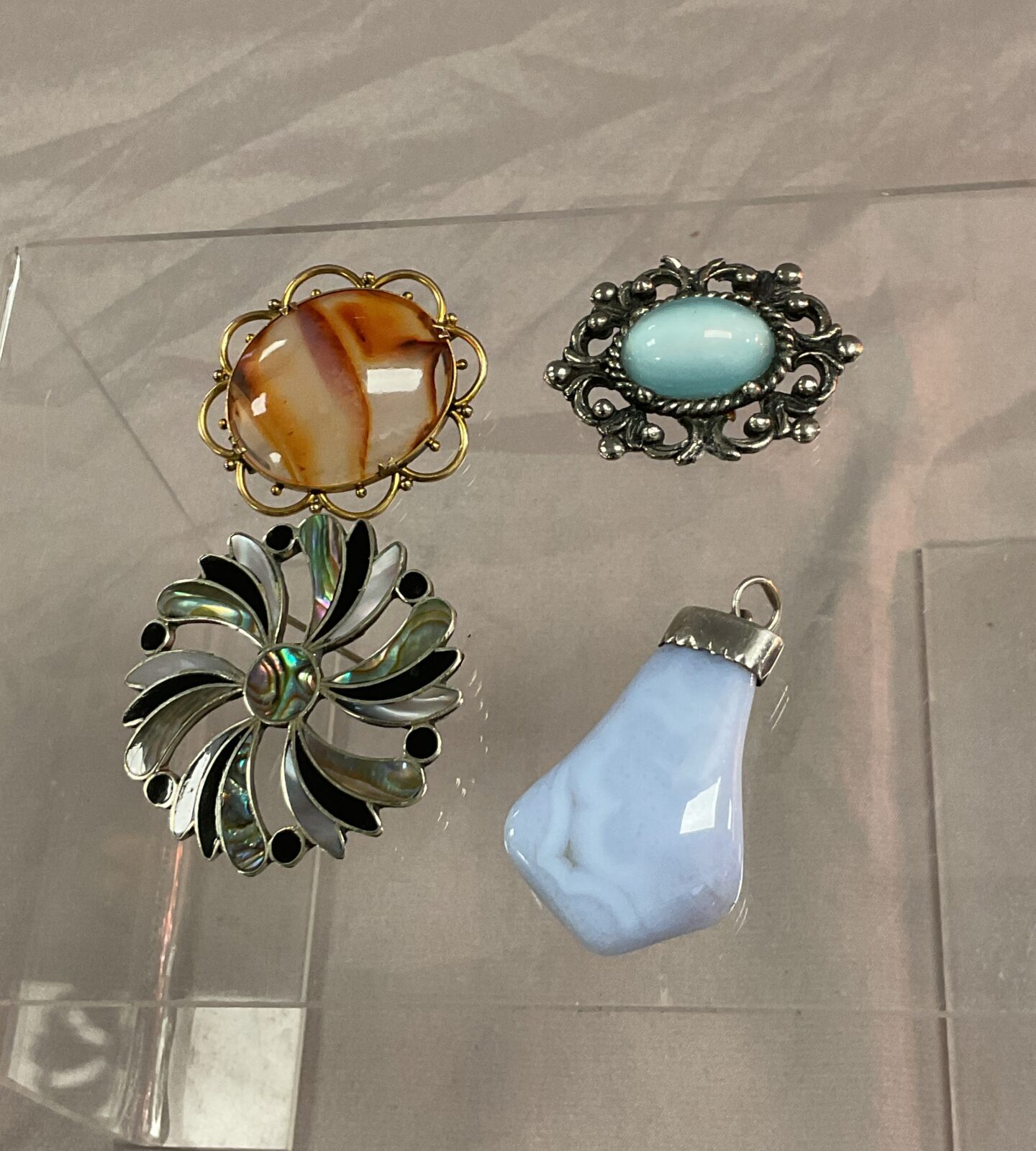 Two vintage brooches and two pendants