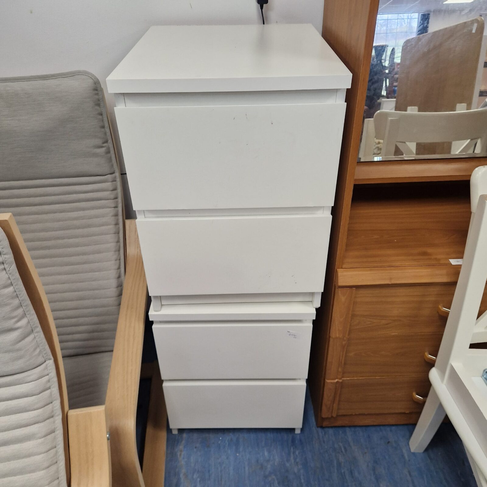 Two white bedside cabinets