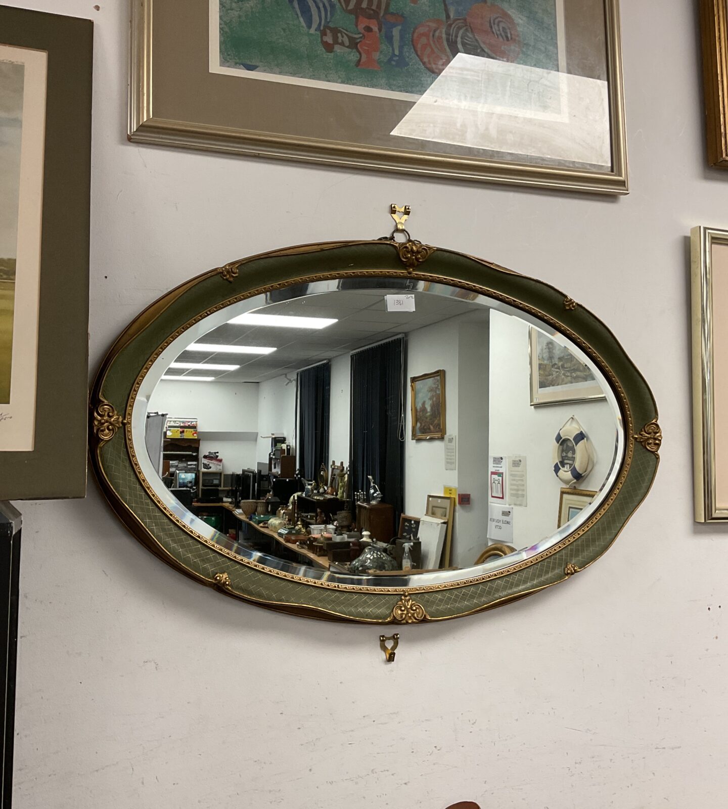 Vintage gilt framed bevel edged oval mirror