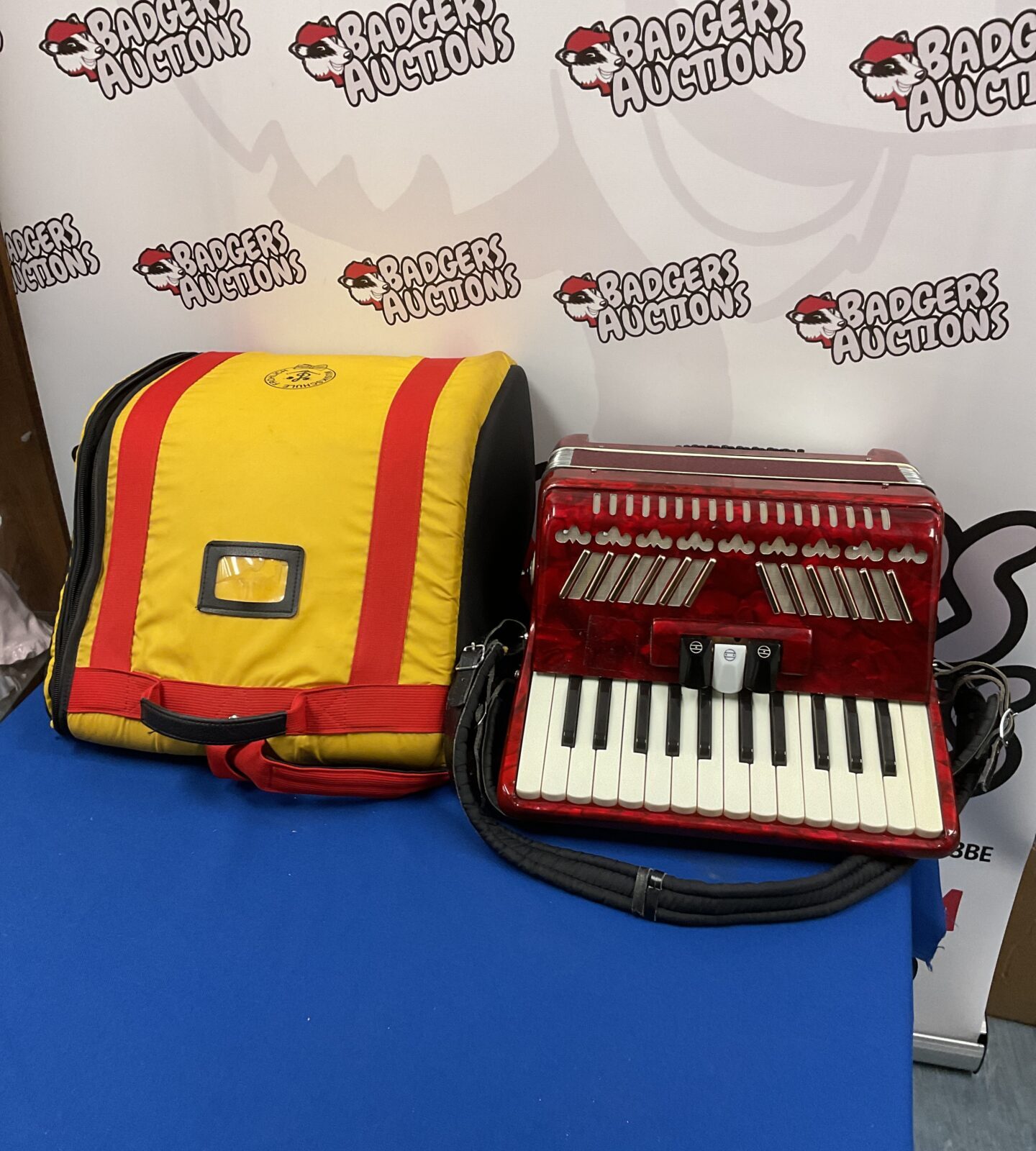 Vintage red accordion with case