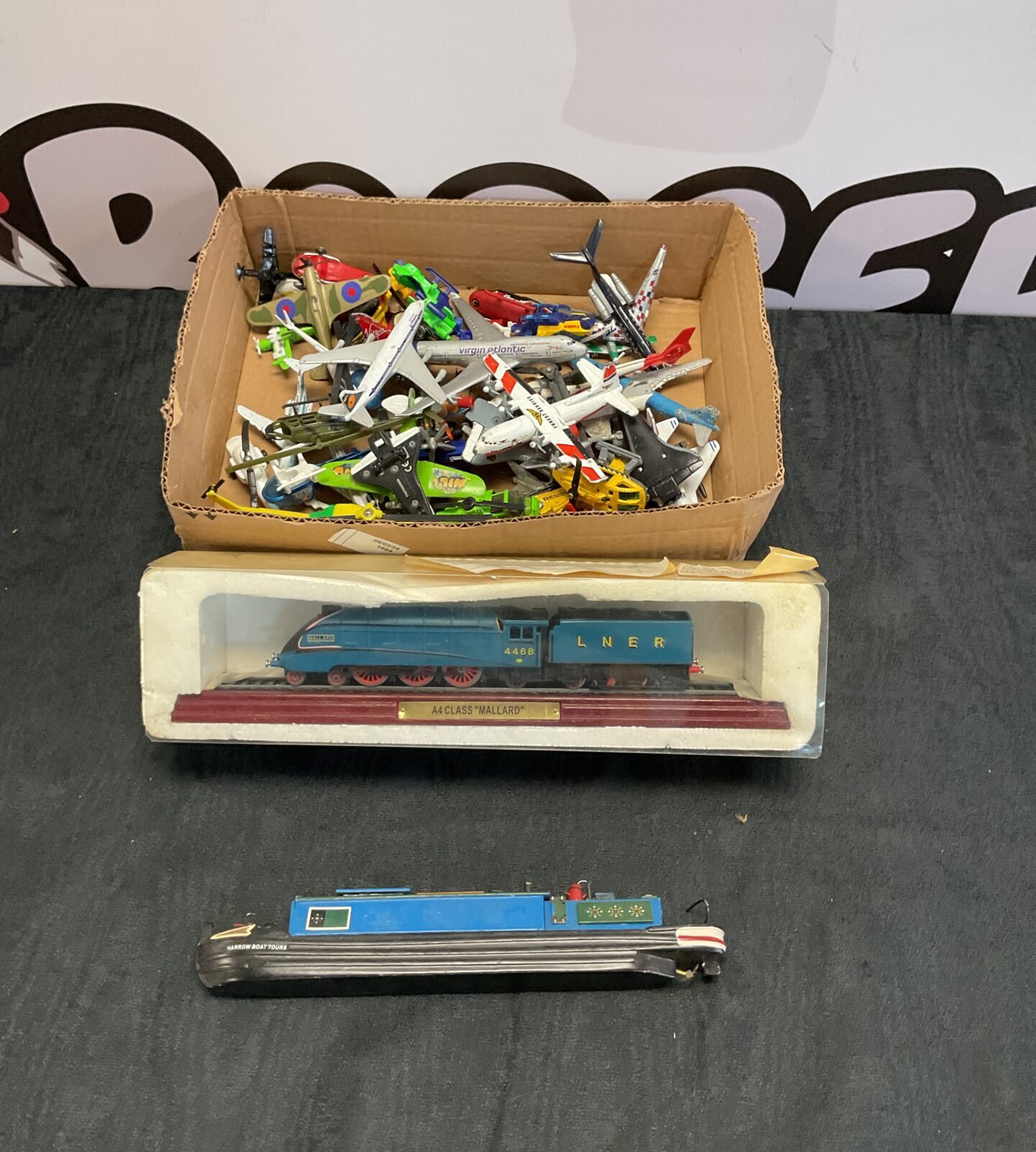 Box of diecast aeroplanes and helicopters inc matchbox and boxed model of a4 class mallard