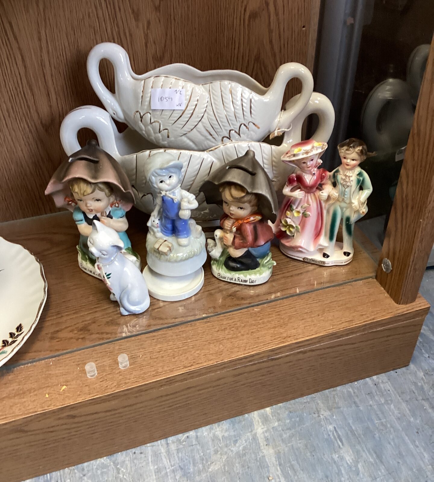 Collection of porcelain figurines and flower holders