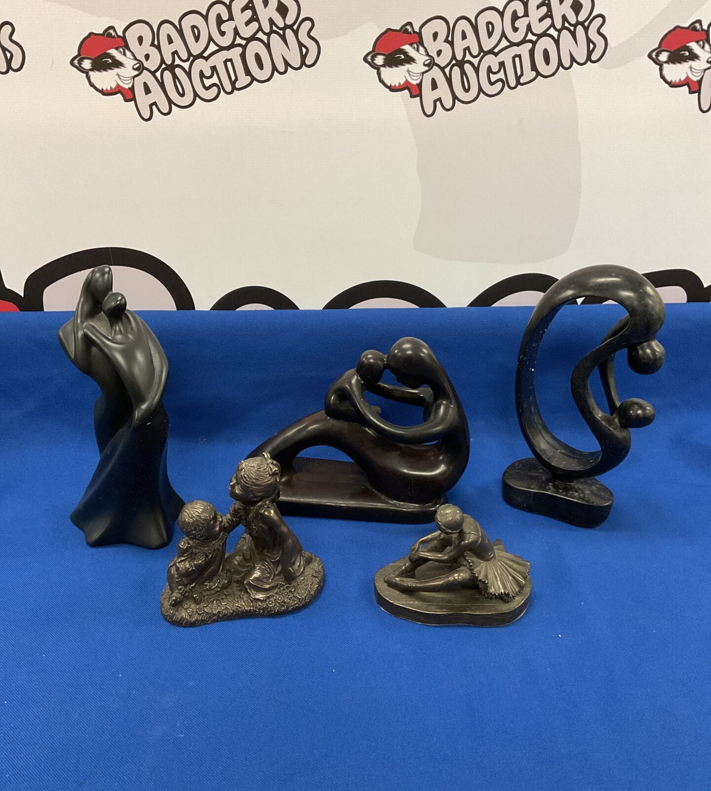 Five bronzed resin & stone sculptures including ballerina & mother & child