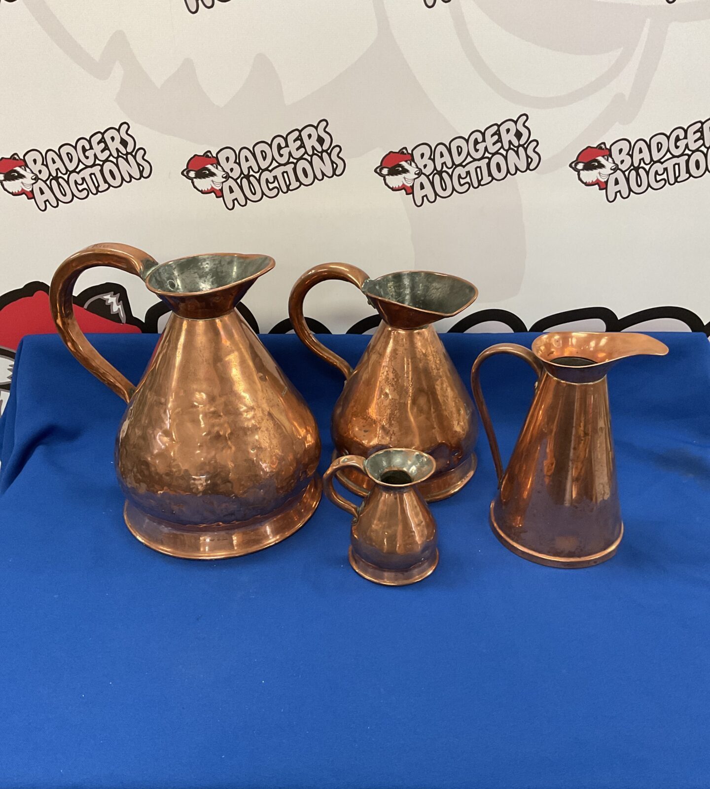 Three pot belly copper jugs inc georgian and one other