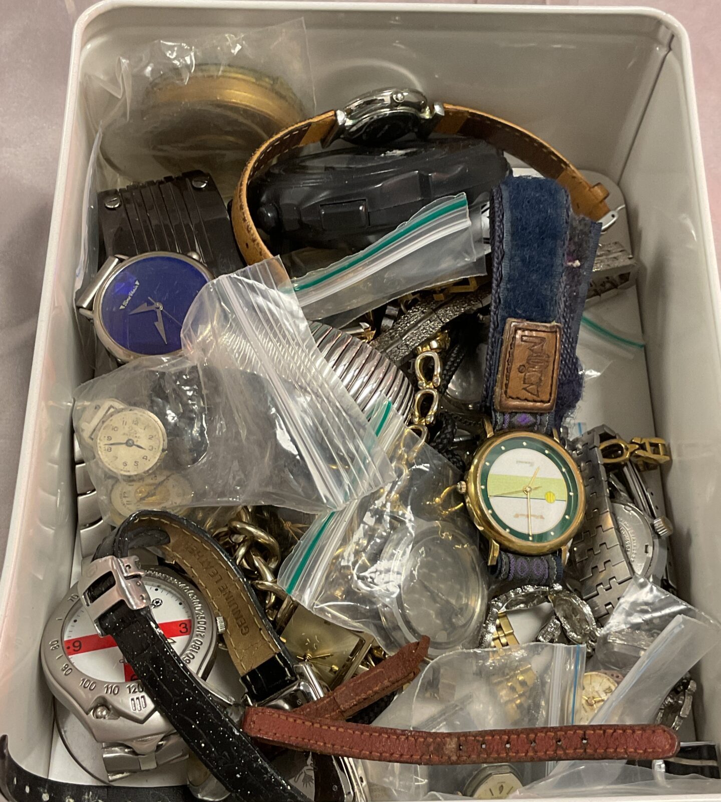 Tin of assorted wristwatches and parts