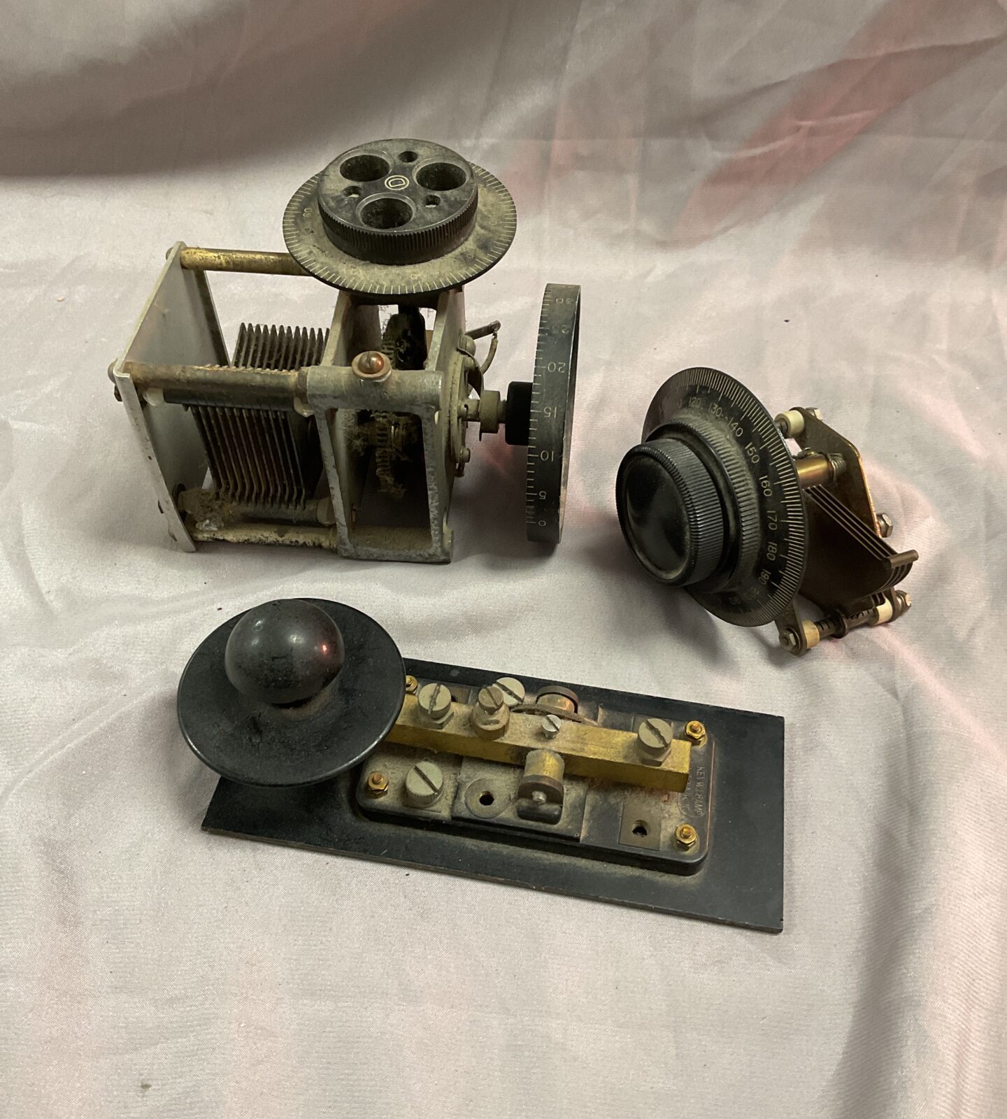 Vintage morse key and two radio tuners