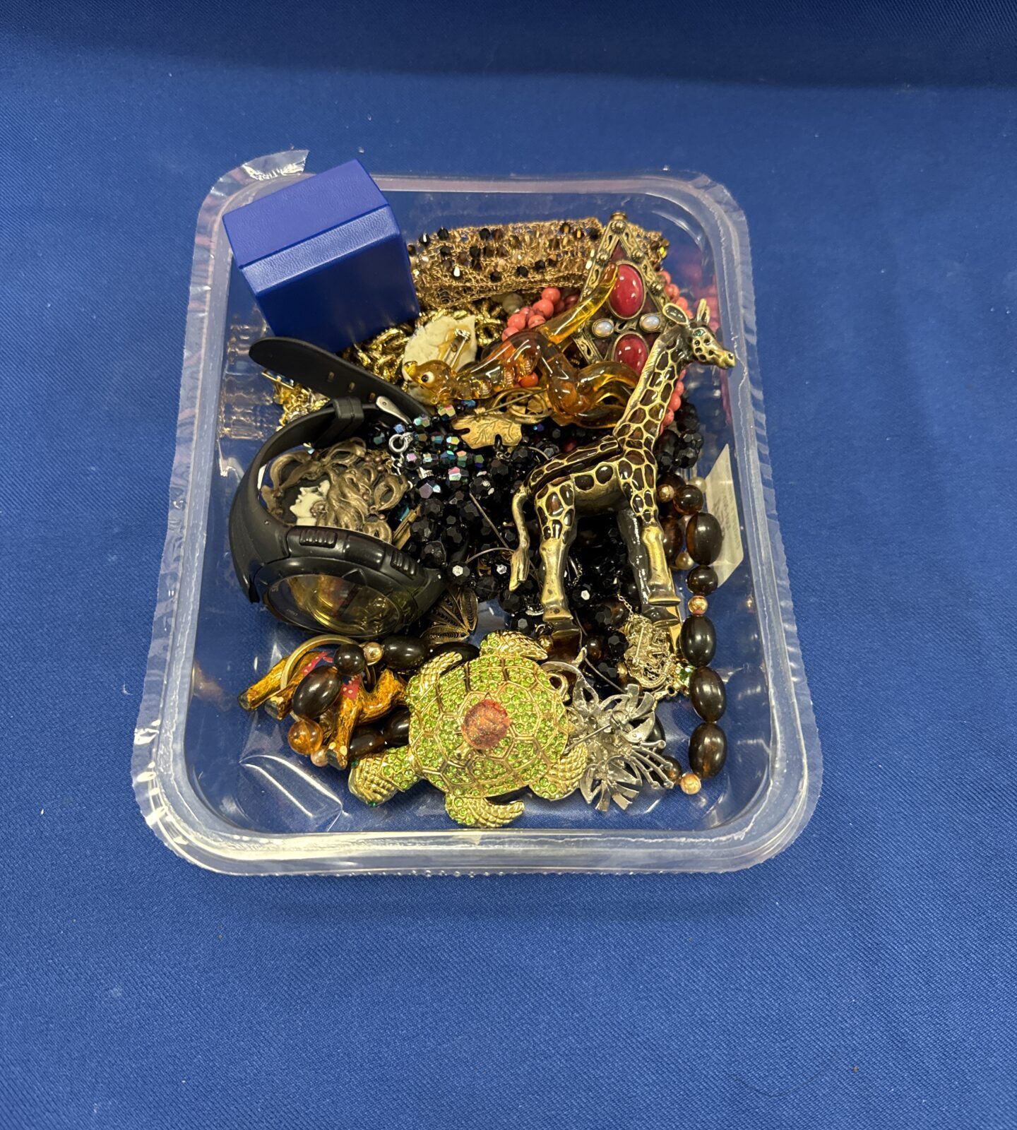 Tray of costume jewellery with a skmei watch