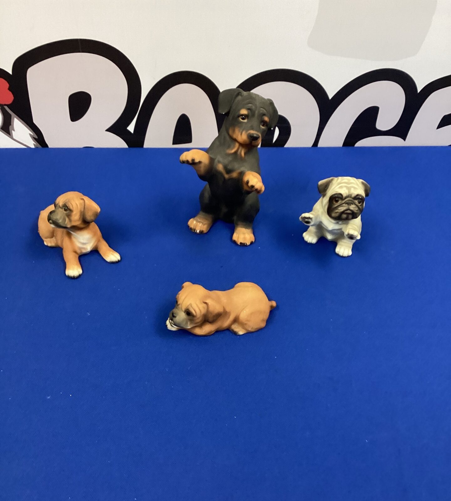 Four pottery dog figurines