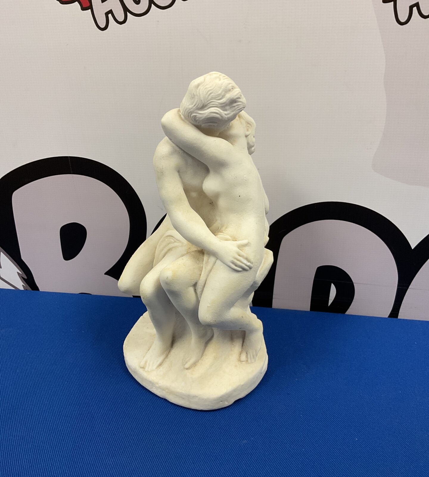 Plaster sculpture of lovers embracing